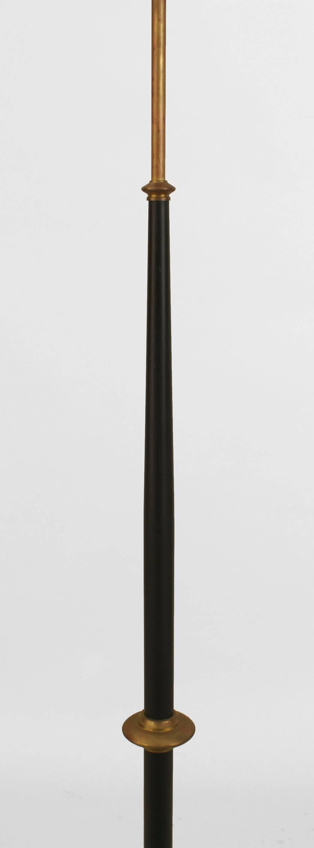 French Art Deco (1940s) ebonized lacquered gilded bronze trim and base floor lamp.
