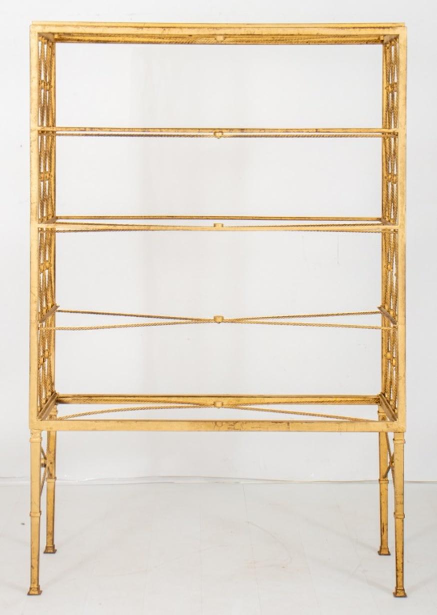 French Art Moderne 1940s gilded steel etagere, of rectangular form conjoined by x-shaped rope twist stretchers, and with x-form stretcher supports, above four banded tapering square columnar legs similarly conjoined, terminating in square feet.
