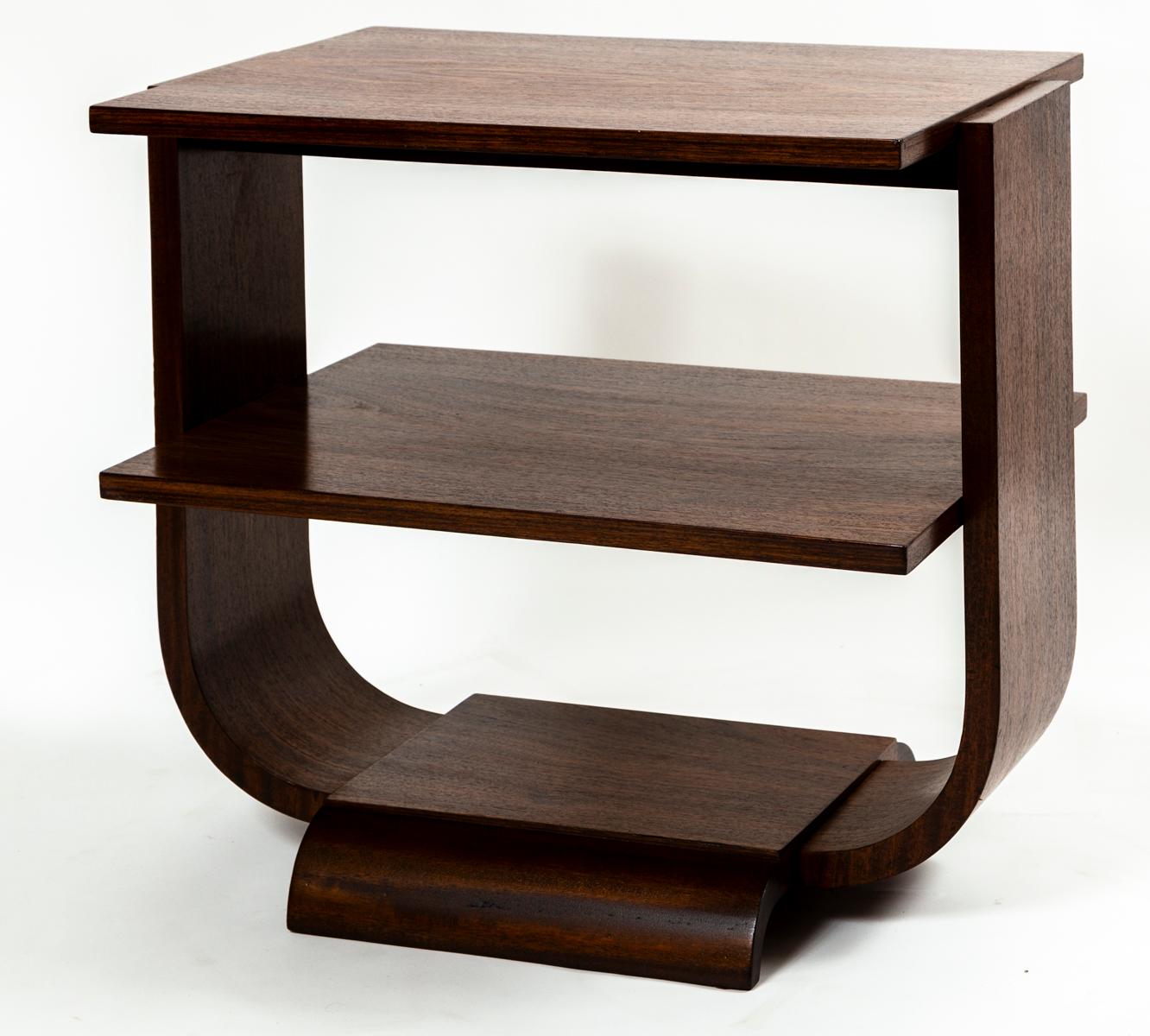 An elegant Art Moderne style two-tiered side table in rosewood and finished in a matte polish

Origin: France

Dating 1950ca

Dimensions: 23 1/2 “high, 26″ wide, 17 1/2” deep

Ref number: 9539