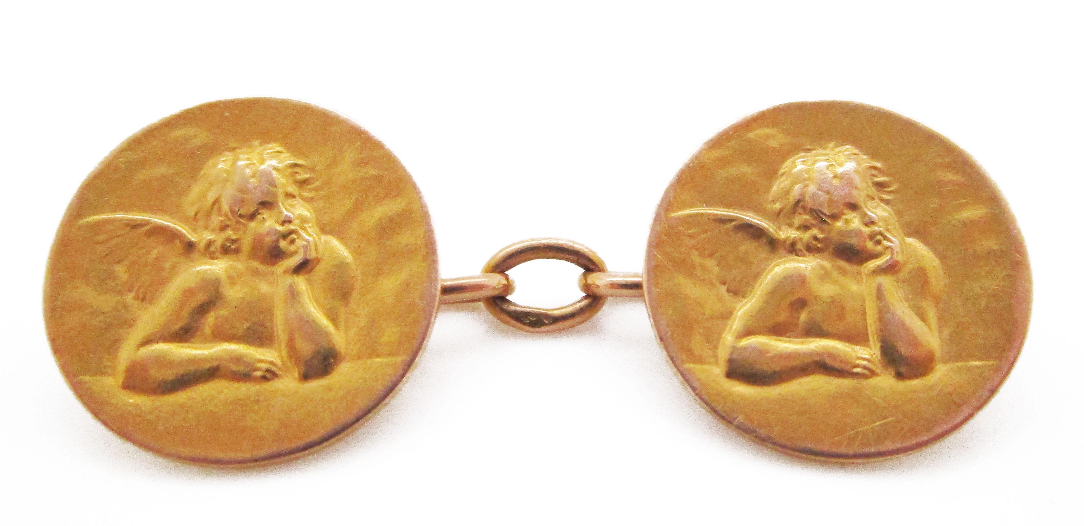 These stunning French hallmarked rich 18k yellow gold cufflinks feature a fantastic Raphael inspired cherub! The links are a circular design that makes them easy to wear. The 18k gold gives them a rich color and an excellent solid feel in the hand.