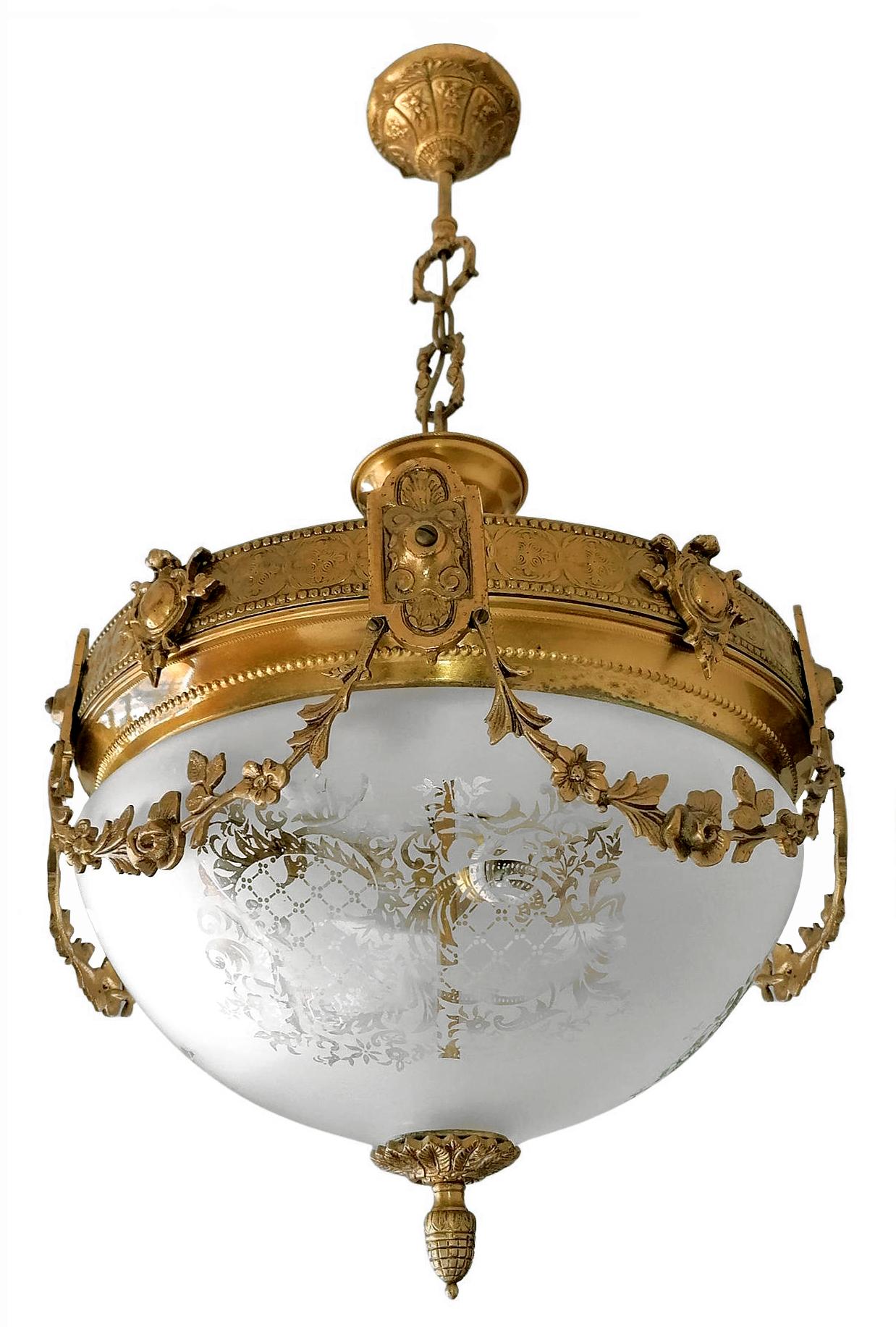 A wonderful gilt bronze and etched-glass two-light ceiling fixture decorated with Fine ornaments and garlands, France, early 20th century.
In very good condition - original etched-glass shades without damages, bronze with beautiful patina.
Two
