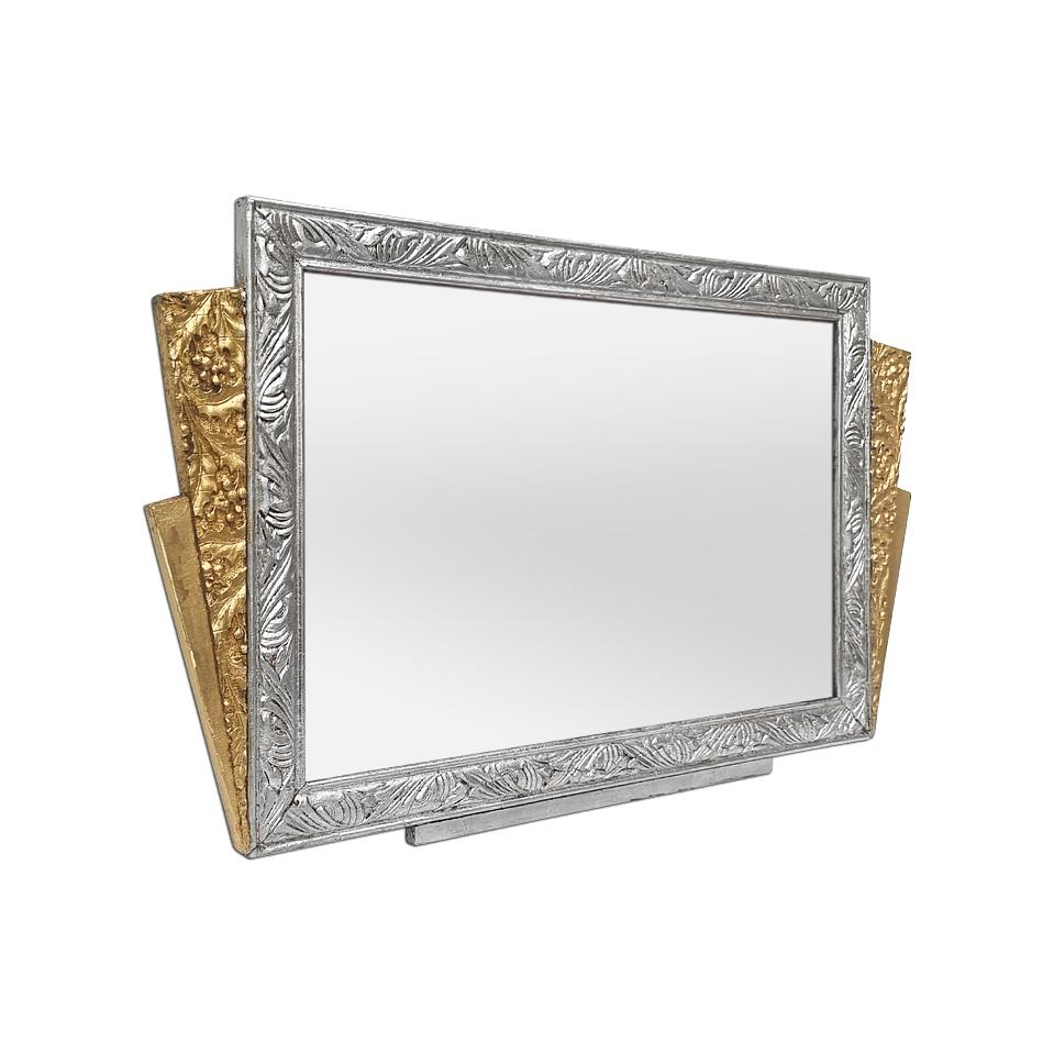 Antique French Art Nouveau mirror, circa 1900. Small mirror with geometric shapes, silvered and gilded, decorated with stylized holly leaves and foliage in the Art Nouveau style. Antique frame re-gilding with leaf. Frame width: 3 - 8 cm / 1.18 -