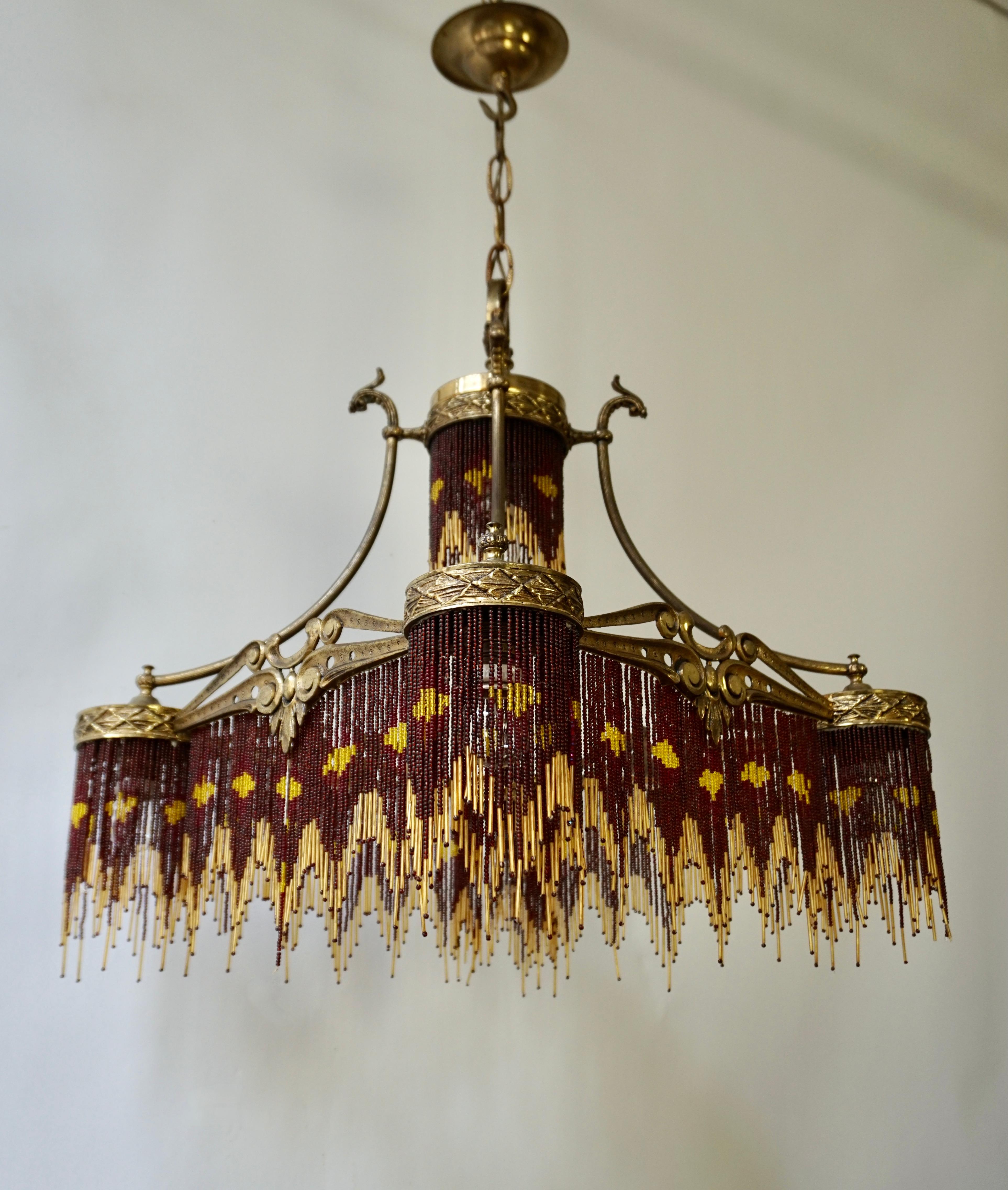 Fabulous Italian in yellow and amber beaded Art Deco/Art Nouveau chandelier.

Measures: 
Width 50 cm.
Depth 50 cm.
Height fixture 60 cm.
Total height 100 cm.
The light requires five single E27 screw fit lightbulbs (60Watt max.) LED