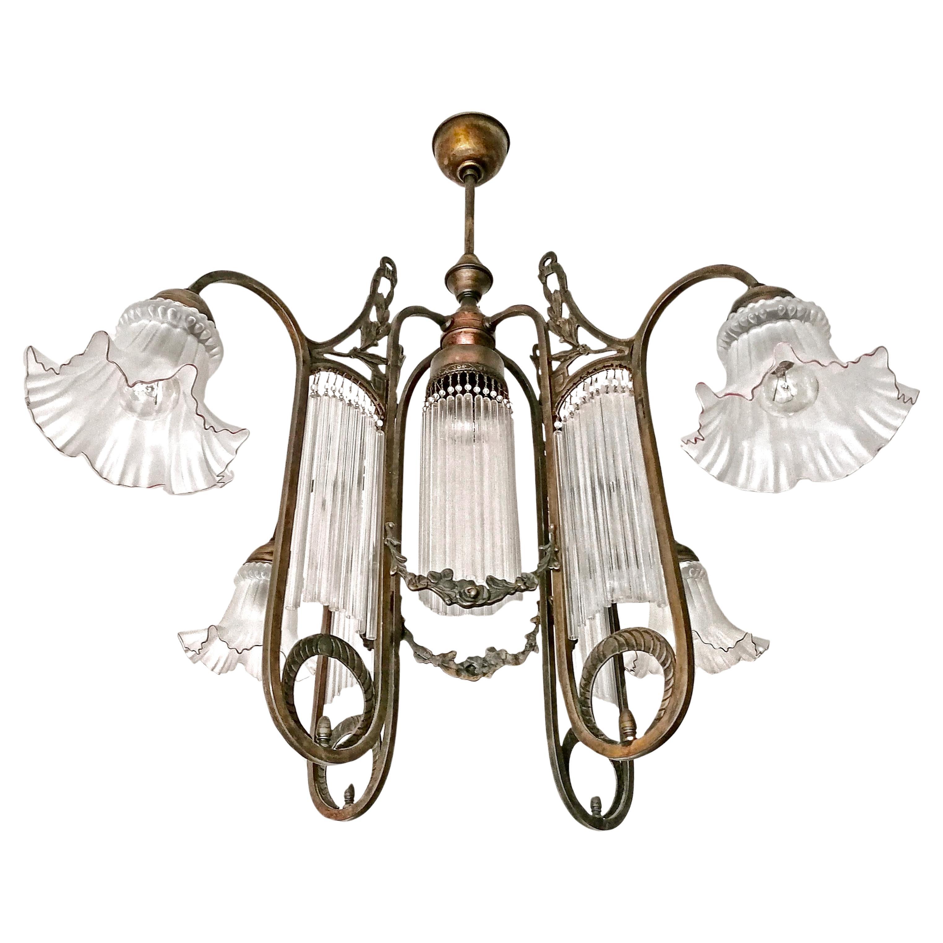 Gorgeous French Art Nouveau Art Deco Chandelier with Garlands and Beaded Glass Straw Fringes in Burnished Brass with four frosted satin art glass lamp shades with purple trim and five light bulbs.

Dimensions: 
Height 33.47 in / 85 cm
Diameter 33.47