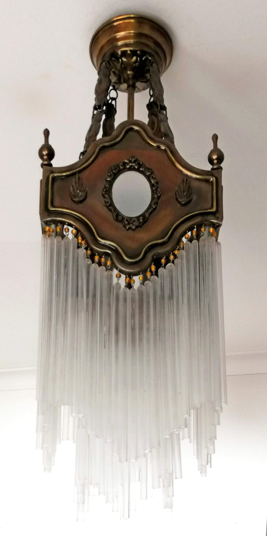 Beautiful antique French Art Nouveau Art Deco gilded bronze lanterns and amber beaded glass straw fringe, 2 tiers.
Measures:
Depth 8.7 in /22 cm
Width 8.7 in /22 cm
Diagonal 12 in/ 30 cm
Height 27.5 in / 70 cm
Weight 6 Kg / 12 lb
3-light bulbs E-14