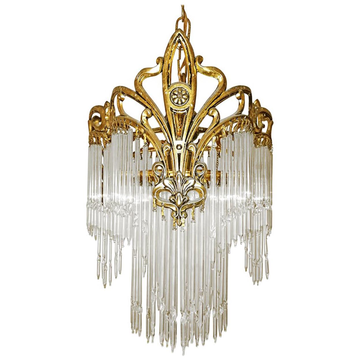 Beautiful antique French Art Nouveau or Art Deco gilt bronze lantern and clear art crystal straw fringe, 2 tiers.
Measures:
Diameter 11.8 in /30 cm
Height 41.3 in (chain=21.6 in) / 105 cm (chain= 55 cm)
Weight 4 Kg / 9 lb
1-light bulbs E-27/