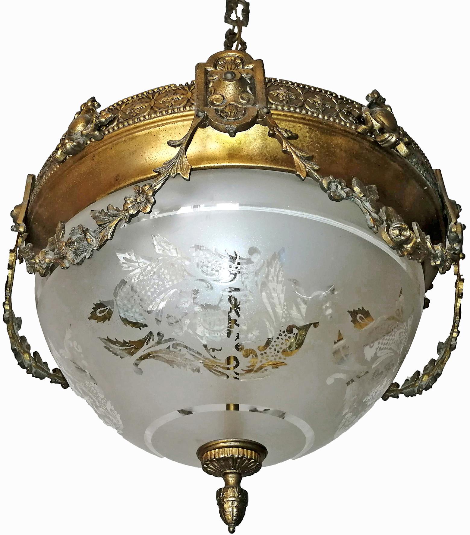 A wonderful gilt bronze and etched-glass two-light ceiling fixture decorated with fine ornaments and garlands, France, early 20th century.
In very good condition - original etched-glass shades without damages, bronze with beautiful patina.
Two large