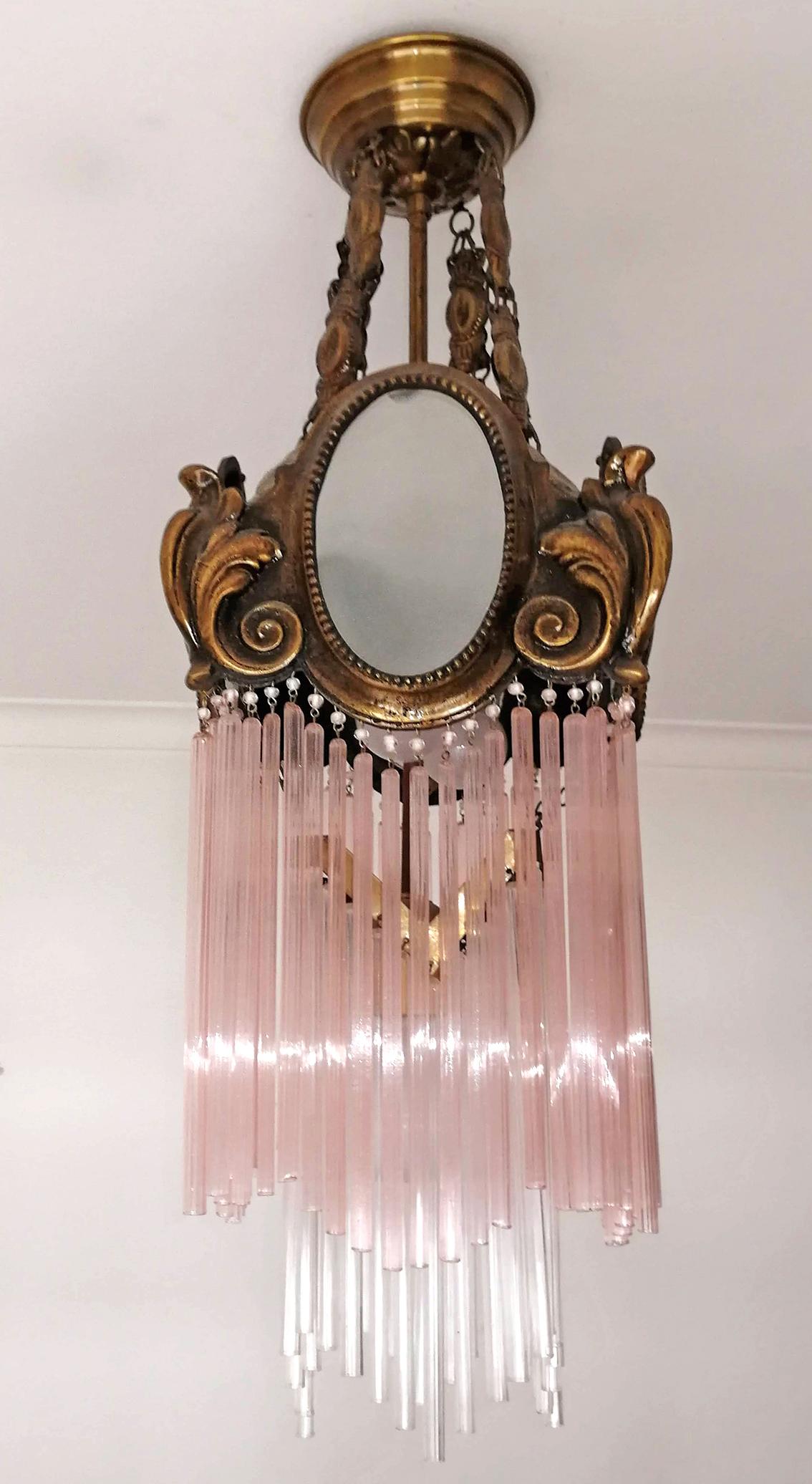 Beautiful antique French Art Nouveau Art Deco gilded bronze lantern and pink glass straw fringe, 2 tiers.
Measures:
Depth 8.7 in /22 cm
Width 8.7 in /22 cm
Diagonal 12 in/ 30 cm
Height 27.5 in / 70 cm
Weight 6 Kg / 12 lb
1-light bulbs E-27/