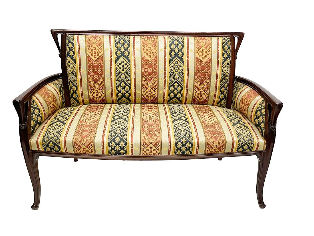 French Art Nouveau bench, sofa by Louis Majorelle, 1900-1910

A beautiful sofa with a highly polished wooden frame, covered with satin fabric with an Art Nouveau pattern. Beautifully elegant, stylish piece of furniture
Louis-Jean-Sylvestre Majorelle