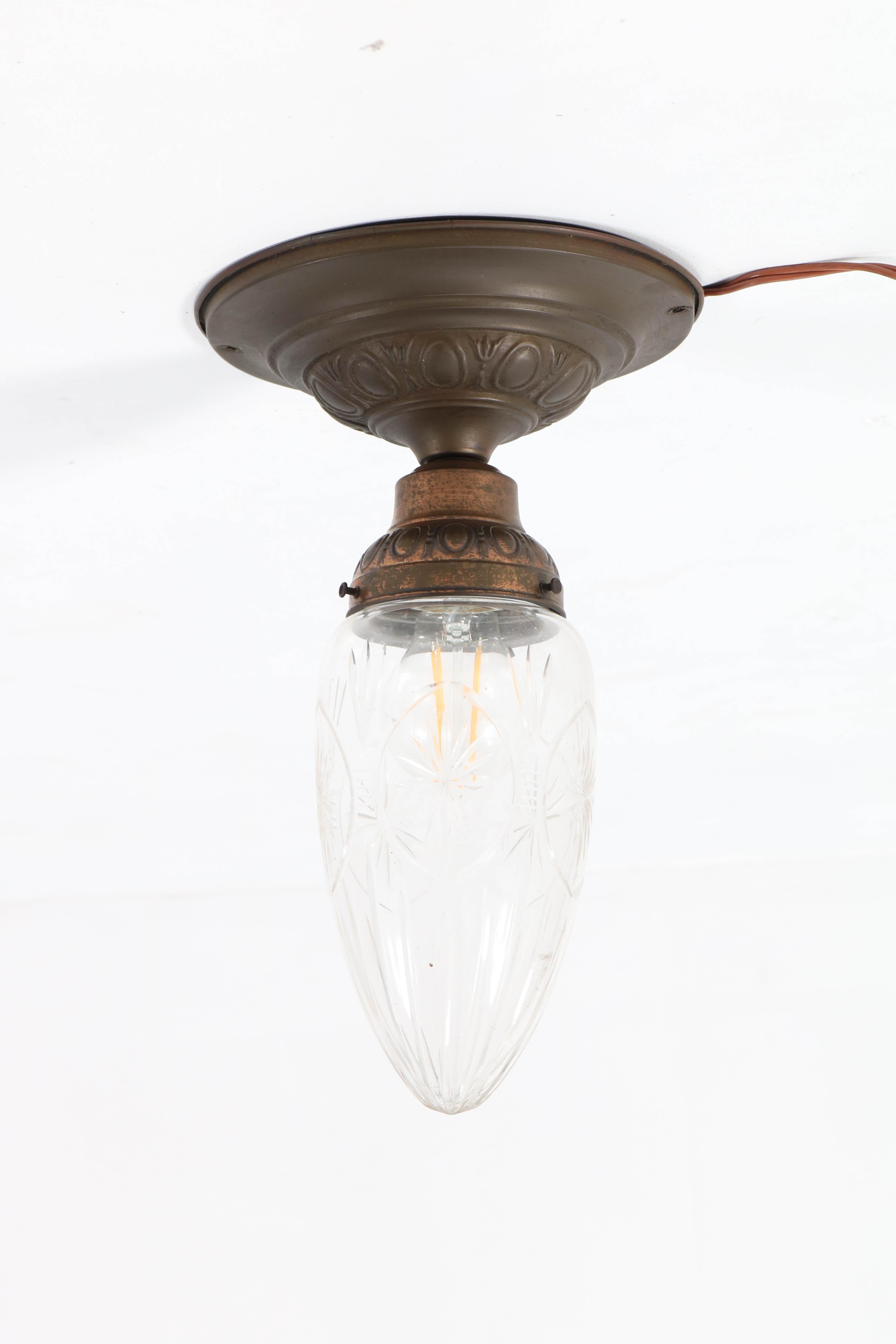 Wonderful French Art Nouveau brass cut blown glass flush mount ceiling light.
Original shade and in very good condition with minor wear consistent with age and use,
preserving a beautiful patina.