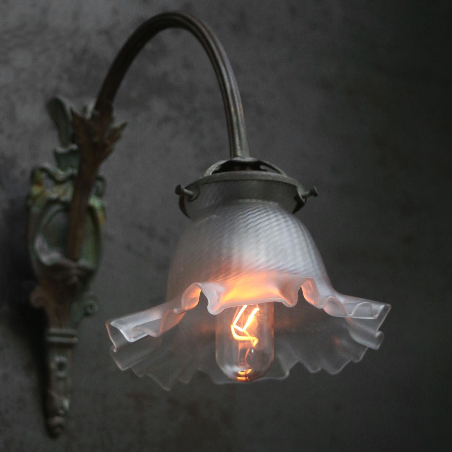 French art nouveau wall lamp
Frosted glass shade with brass wall piece and arm

B22 bulb holder / Bayonet

Weight: 0.70 kg / 1.5 lb

Priced per individual item. All lamps have been made suitable by international standards for incandescent light