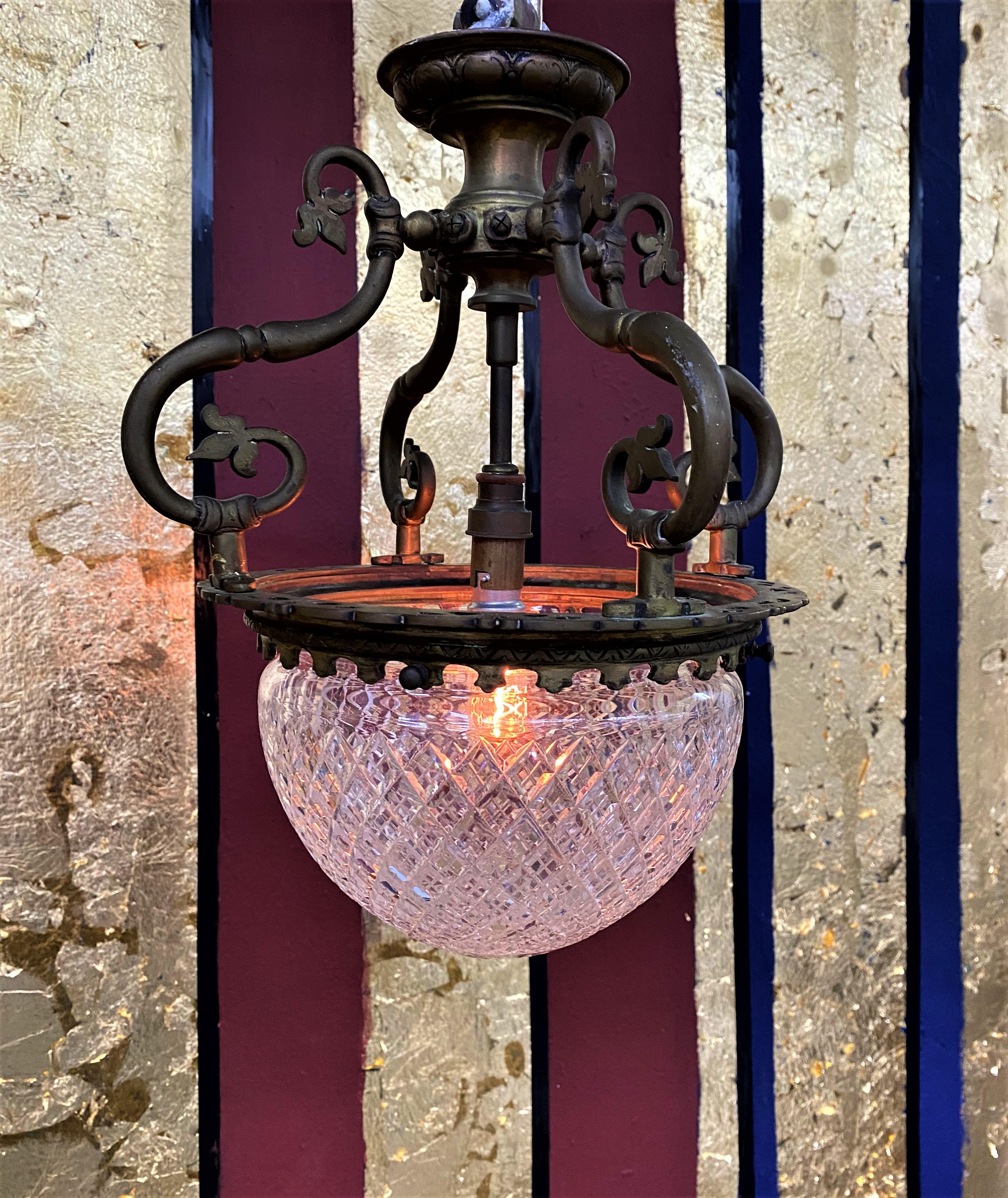 Charming solid and Heavy Bronze chandelier with a handcut crystal central globe. 
Made in France, circa 1920.
This Light can be installed as a flush mount or hung from a chain if so desired.