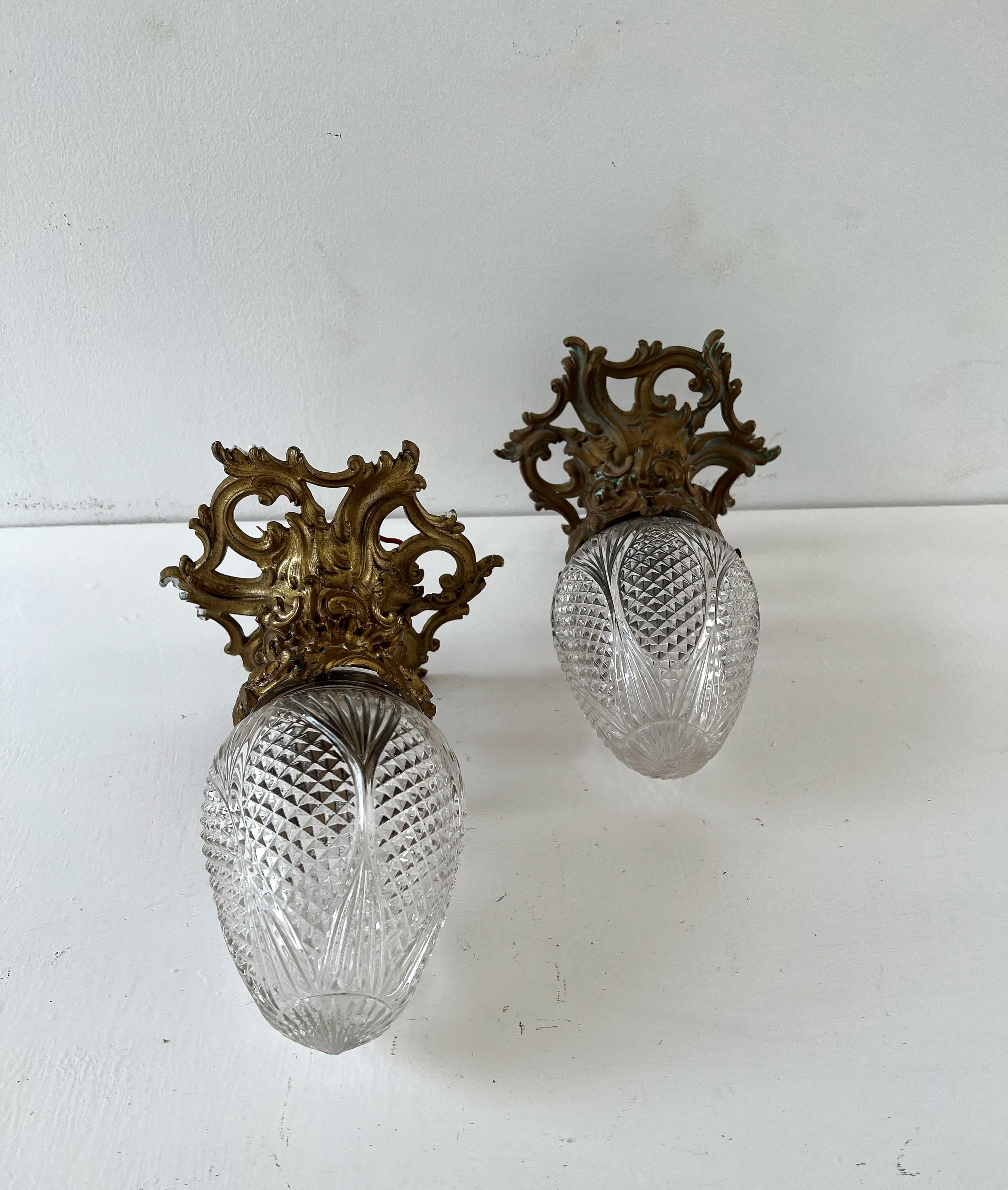 Charming solid and Heavy Bronze chandeliers with a hand cut crystal central globe. 
Made in France, circa 1920.
These Lights can be installed as a flush mount or hung from a chain if so desired.