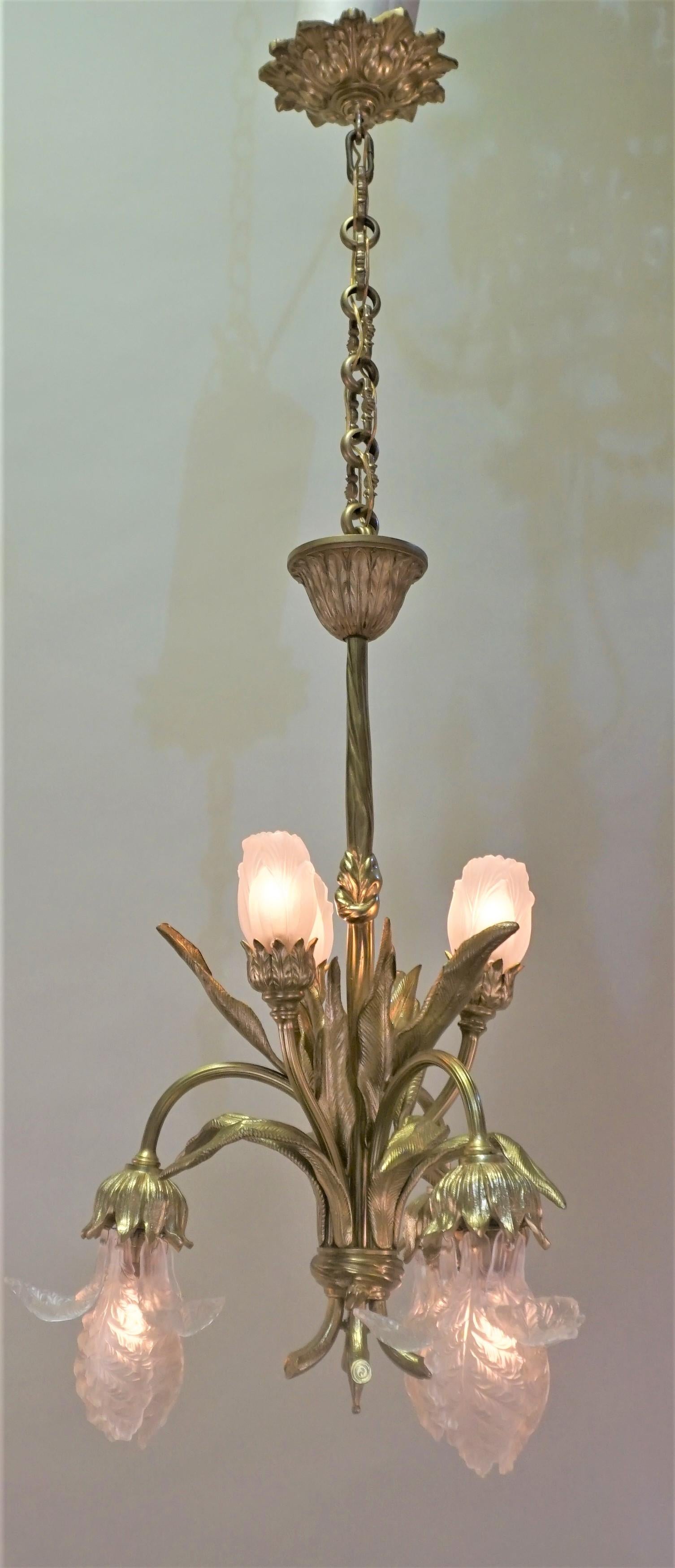 Elegant six-light bronze and Art Nouveau chandelier with six part glass tulip shades.
Total height is 42