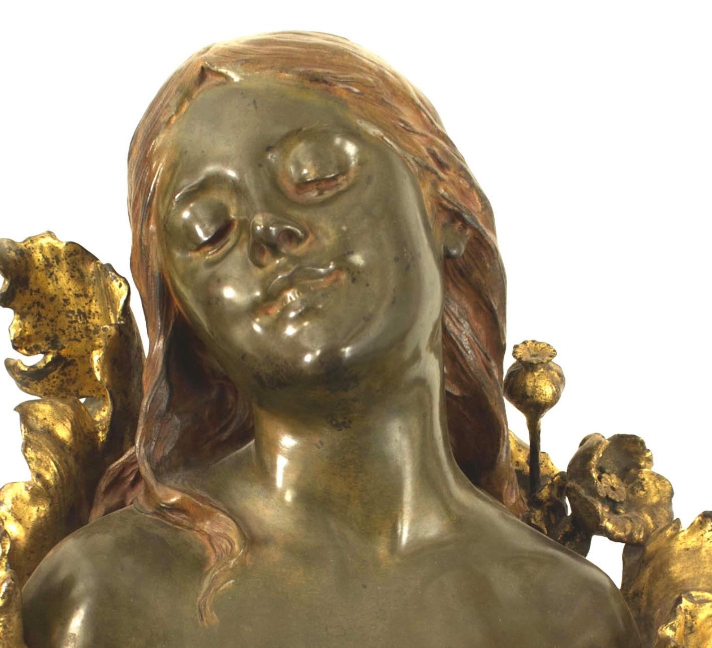 French Art Nouveau bronze bust of lady coming out of gilt floral design base (signed H. GODET, Med d'or).
  