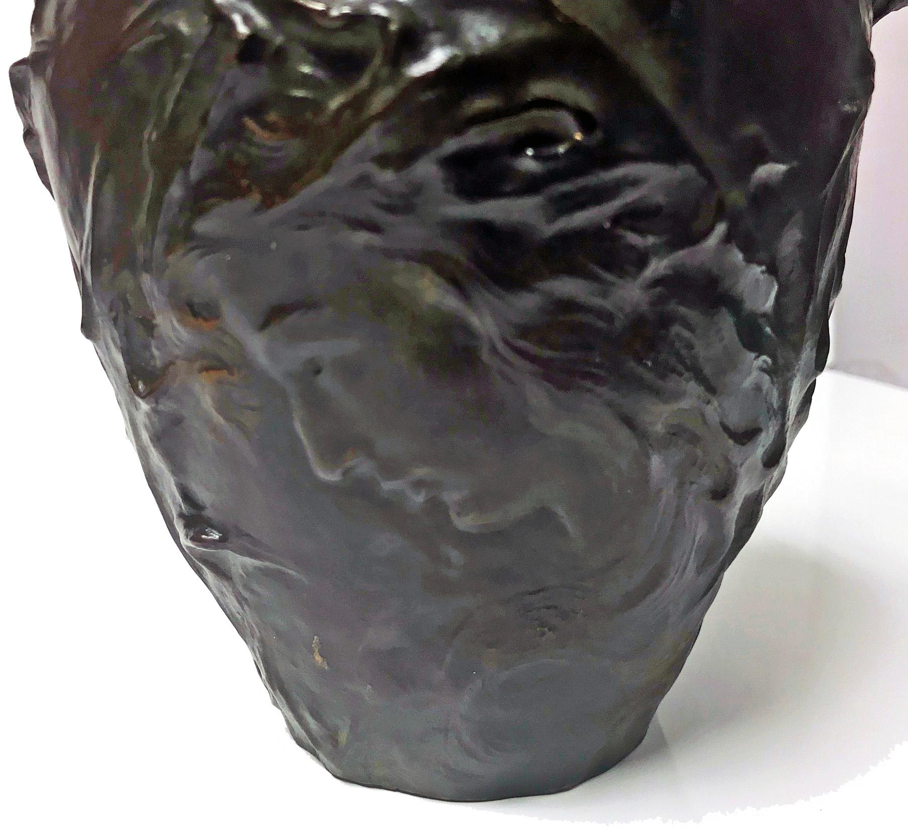 French Art Nouveau bronze jug vase Jeanne Jozon (1868-1946) depicting Breton woman’s face surround of thistles and thistle handle. Finished in dark green patina with shades of brown red and purple. Signed ‘J Jozon Salon des Beaux Arts’and ‘Bronze