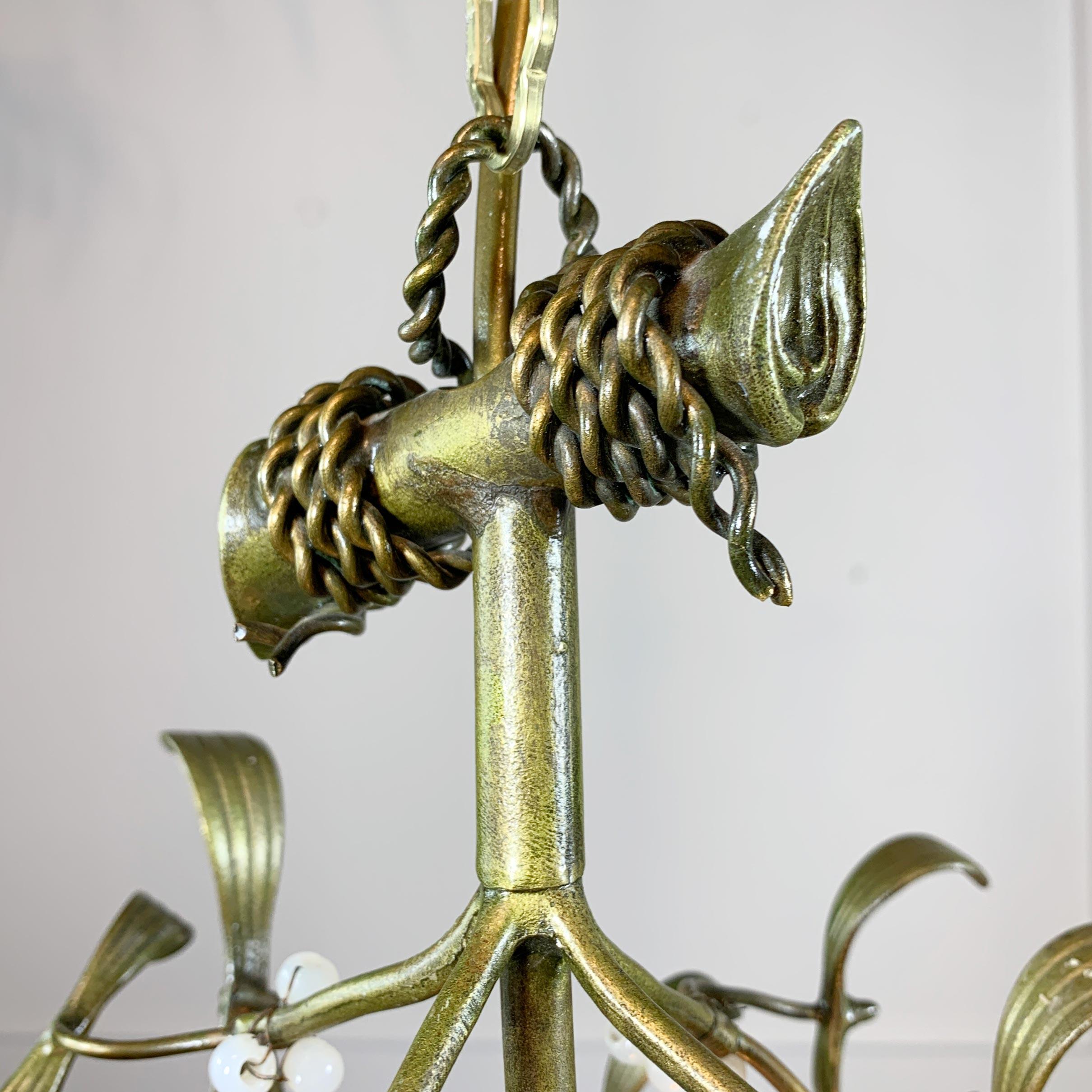 An exquisite French Art Nouveau boule de gui/mistletoe ball chandelier, in absolutely stunning condition, decorated with hand painted mistletoe leaves and opaline glass berries, the twisted wire hanging loop to the branched top of the