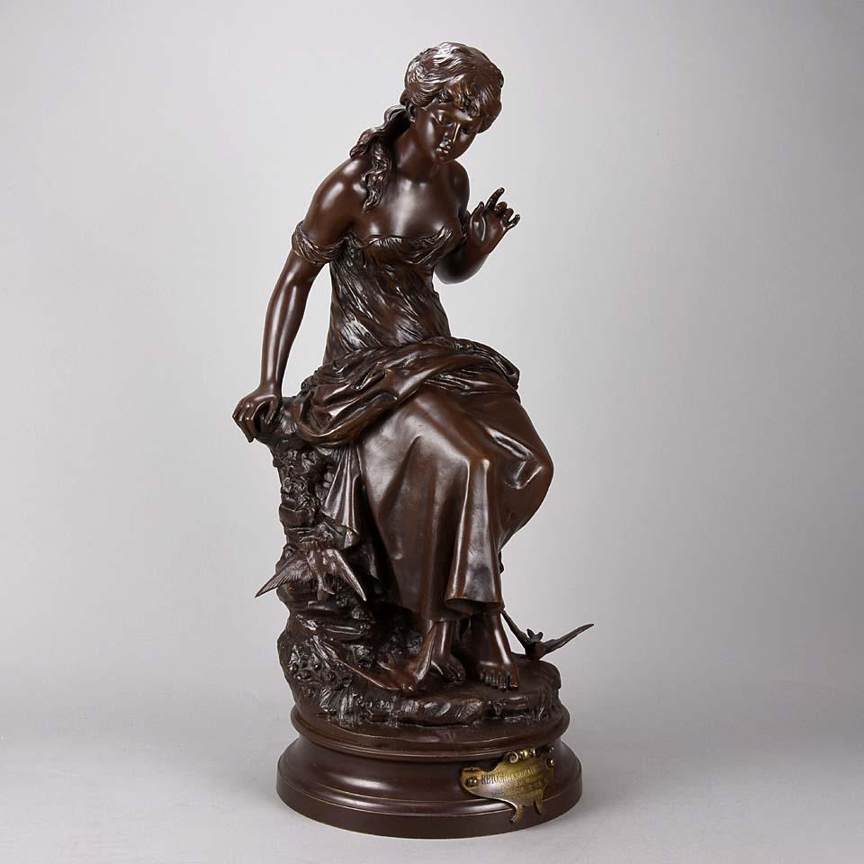 Very pretty late 19th century Art Nouveau bronze study of a young beauty sat upon a rocky outcrop surrounded by swallows, with excellent rich red/brown patina and fine surface detail. Raised on a bronze base, titled to the fore and signed Aug