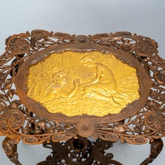 Art Nouveau patinated and gilt cast iron side table