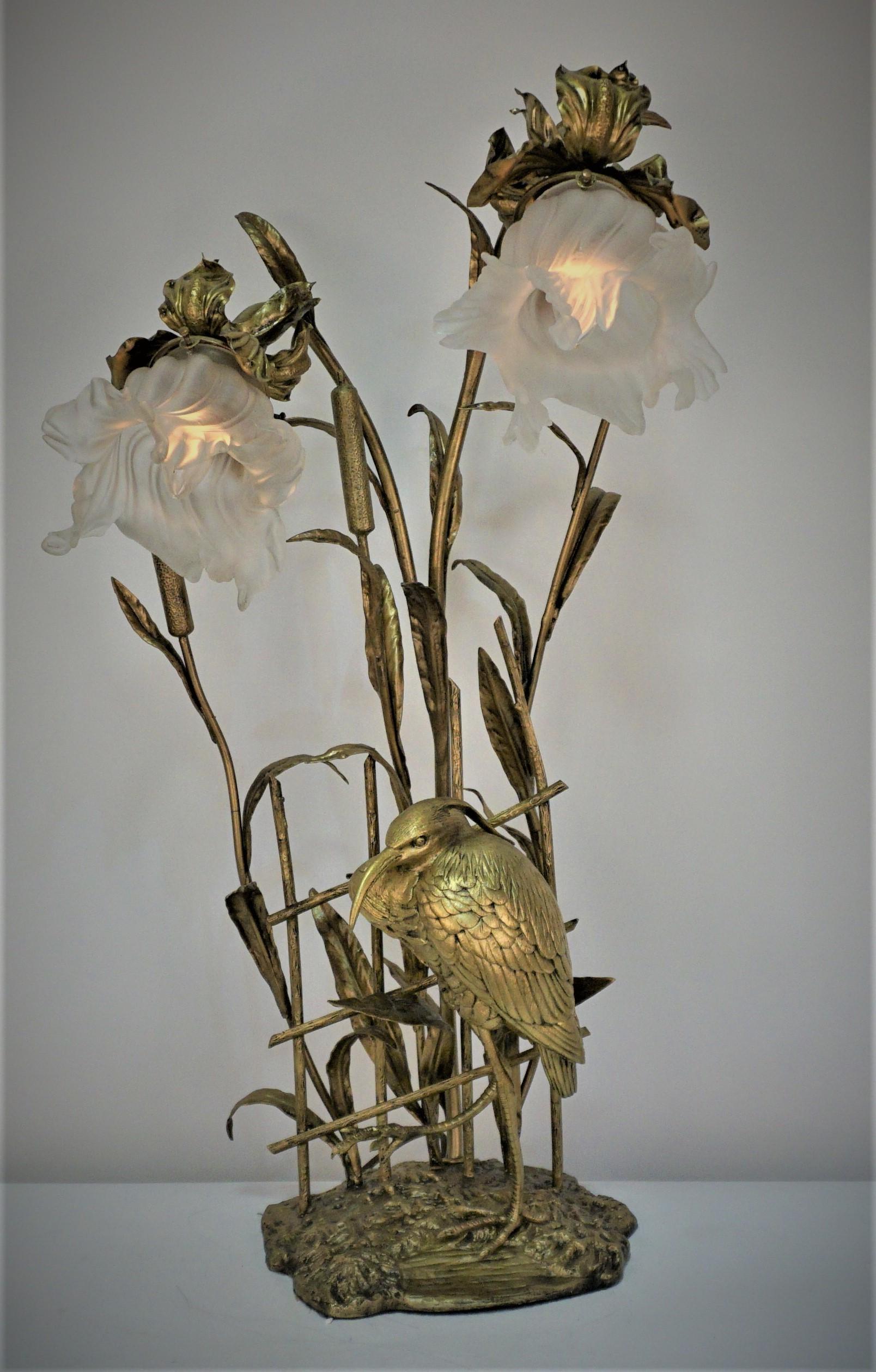 Bronze bird and wetland plants and beautiful flora blown glass shades table lamp.