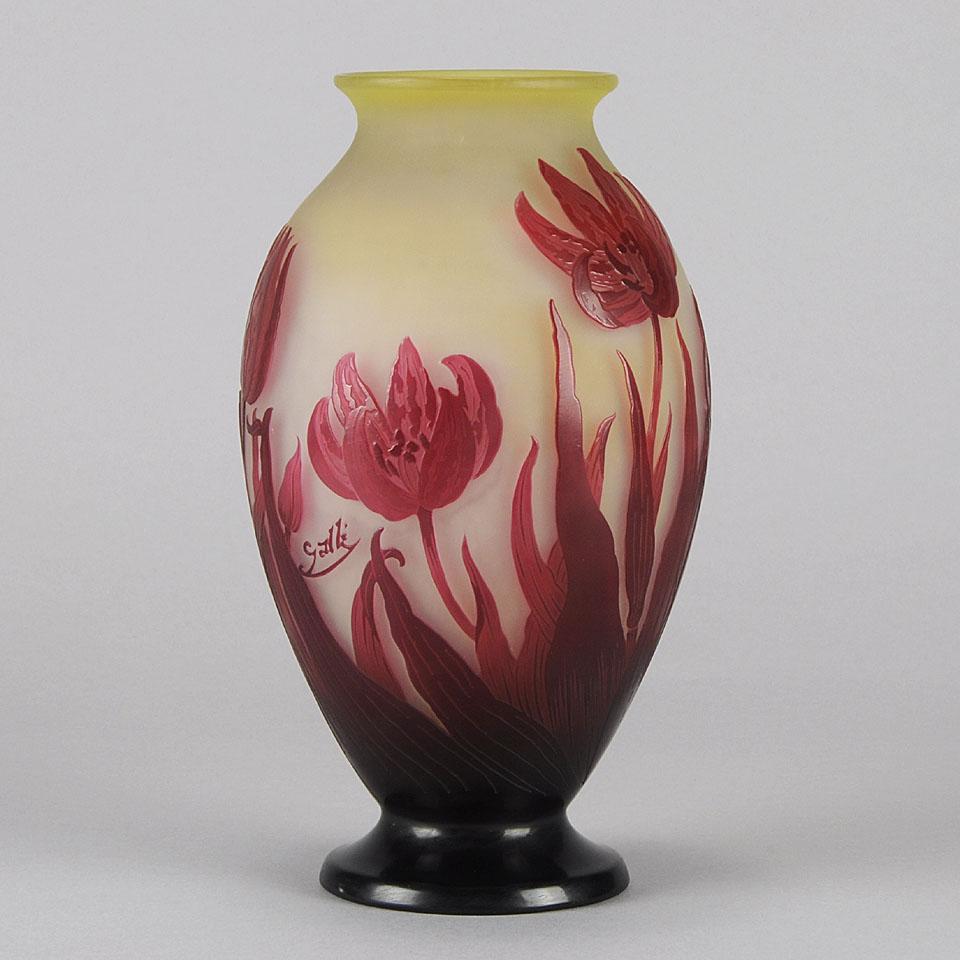 A vibrant Art Nouveau French cameo glass vase of bulbous form acid cut and etched with a deep red blossoming tulip design against a warm yellow field, signed Gallé.



Emile Gallé (French, 1846 ~ 1904)  born in Nancy, France, in 1846, Emile Gallé is