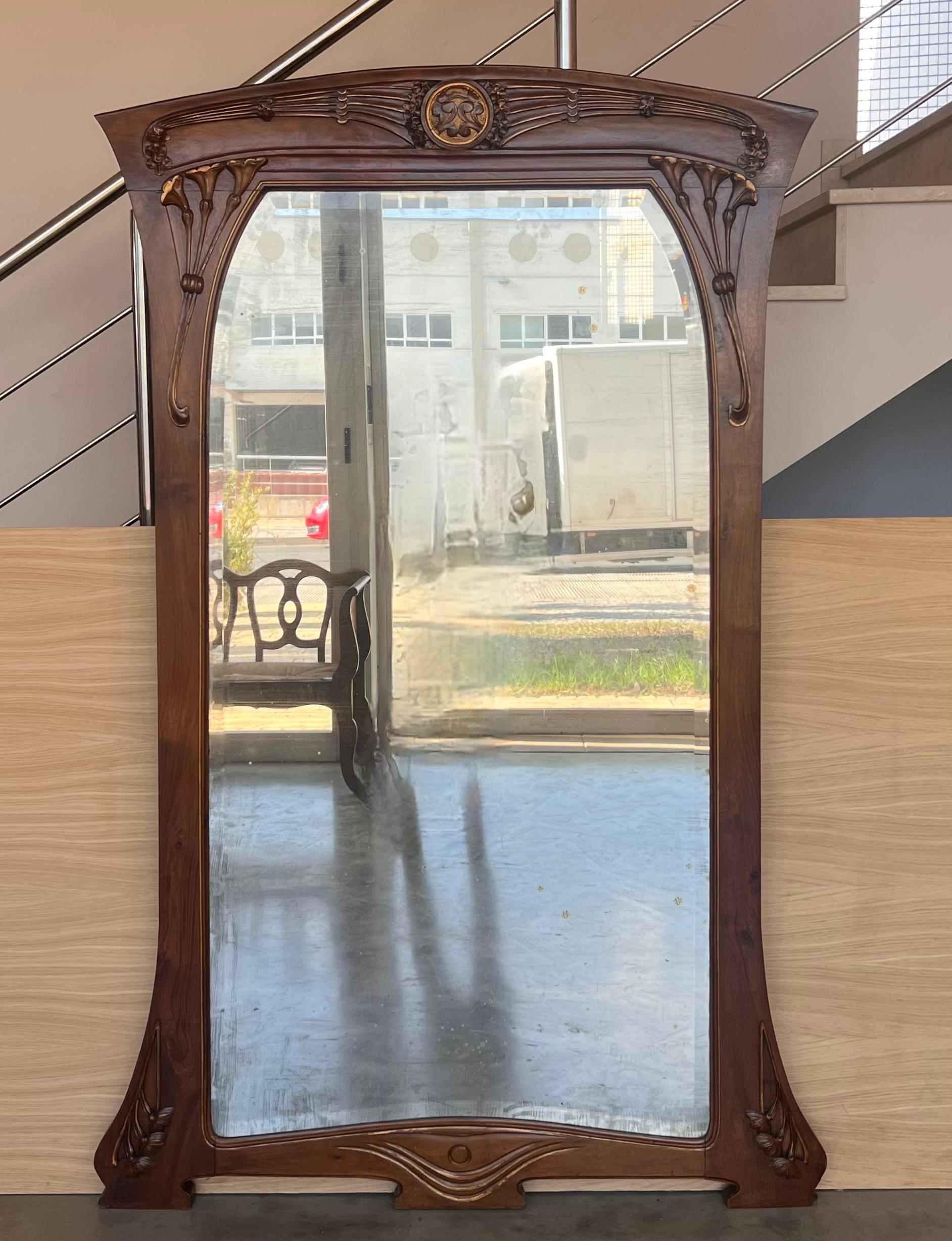 Art Nouveau Wood Mantle Wall Mirror Glass Embossed . A superb handcrafted late 19th century period antique mirror with original glass . Embossed Artwork to decorate your interior from the Romantic period of the Art Nouveau.  Pewter or tin (and or