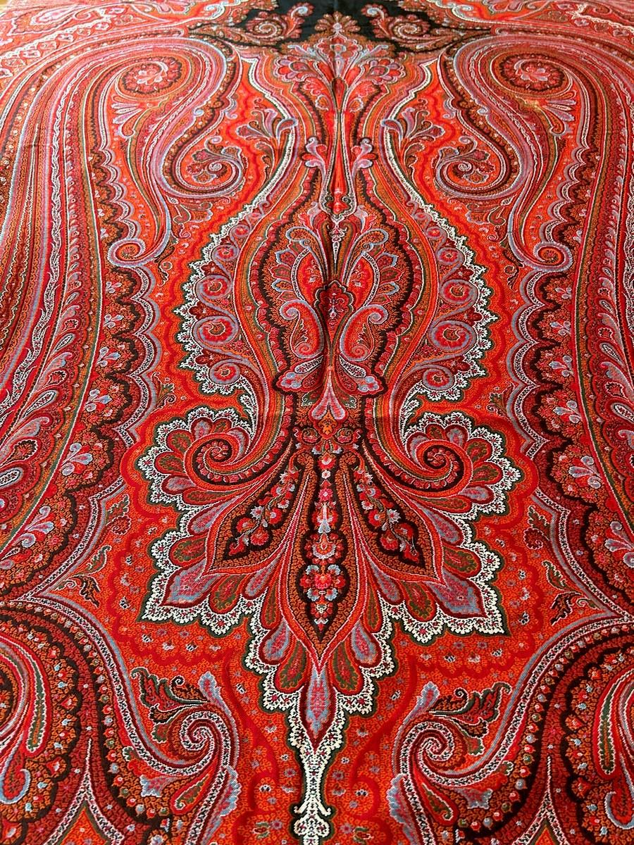Circa 1880
France
Very fine French cashmere shawl - Lyon - in wool woven on Jacquard loom with a cut and throw technique. Art Nouveau decoration with a rich palette of 6 colours with a languid palm design around a black reserve. Fringed harlequin