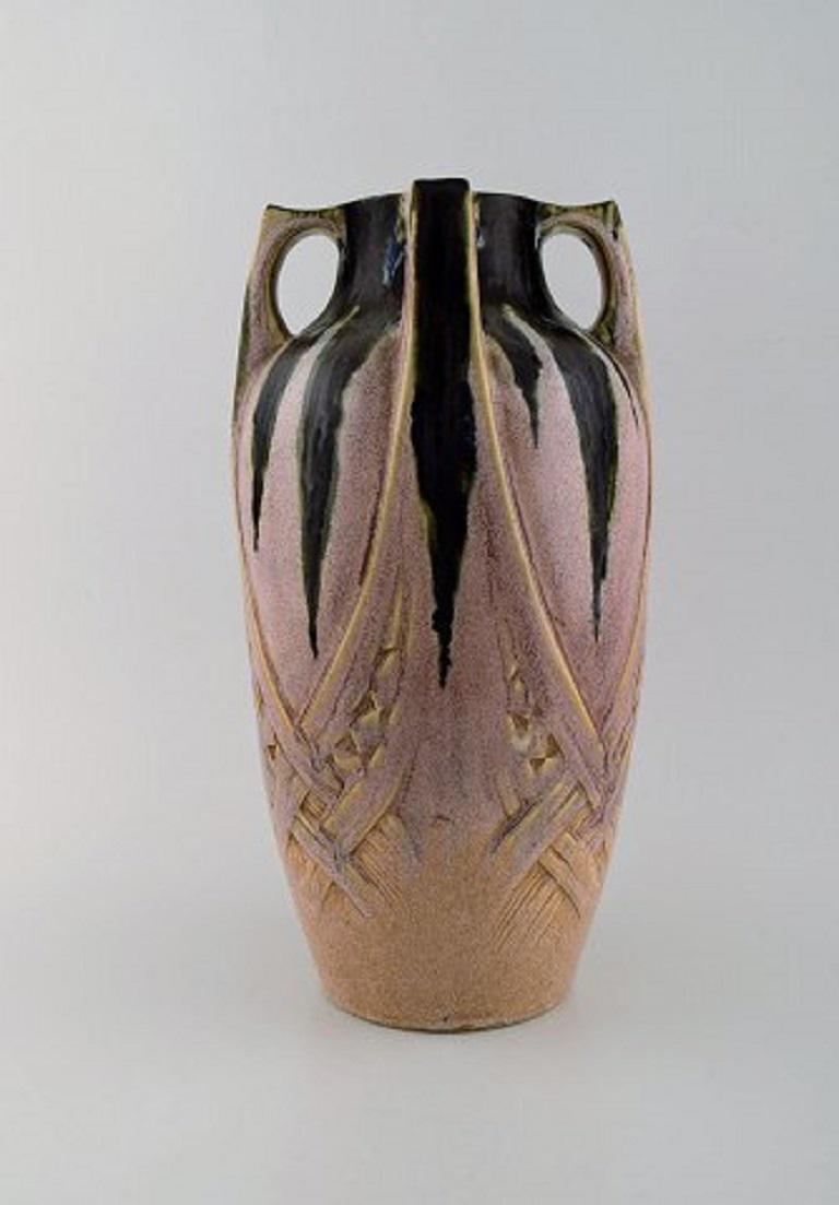 French Art Nouveau ceramic vase, Denbac (1909-1952) produced in Vierzon. Beautiful polychrome glaze, circa 1920.
Signed.
Measures: 33 x 17.5 cm.
In very good condition.