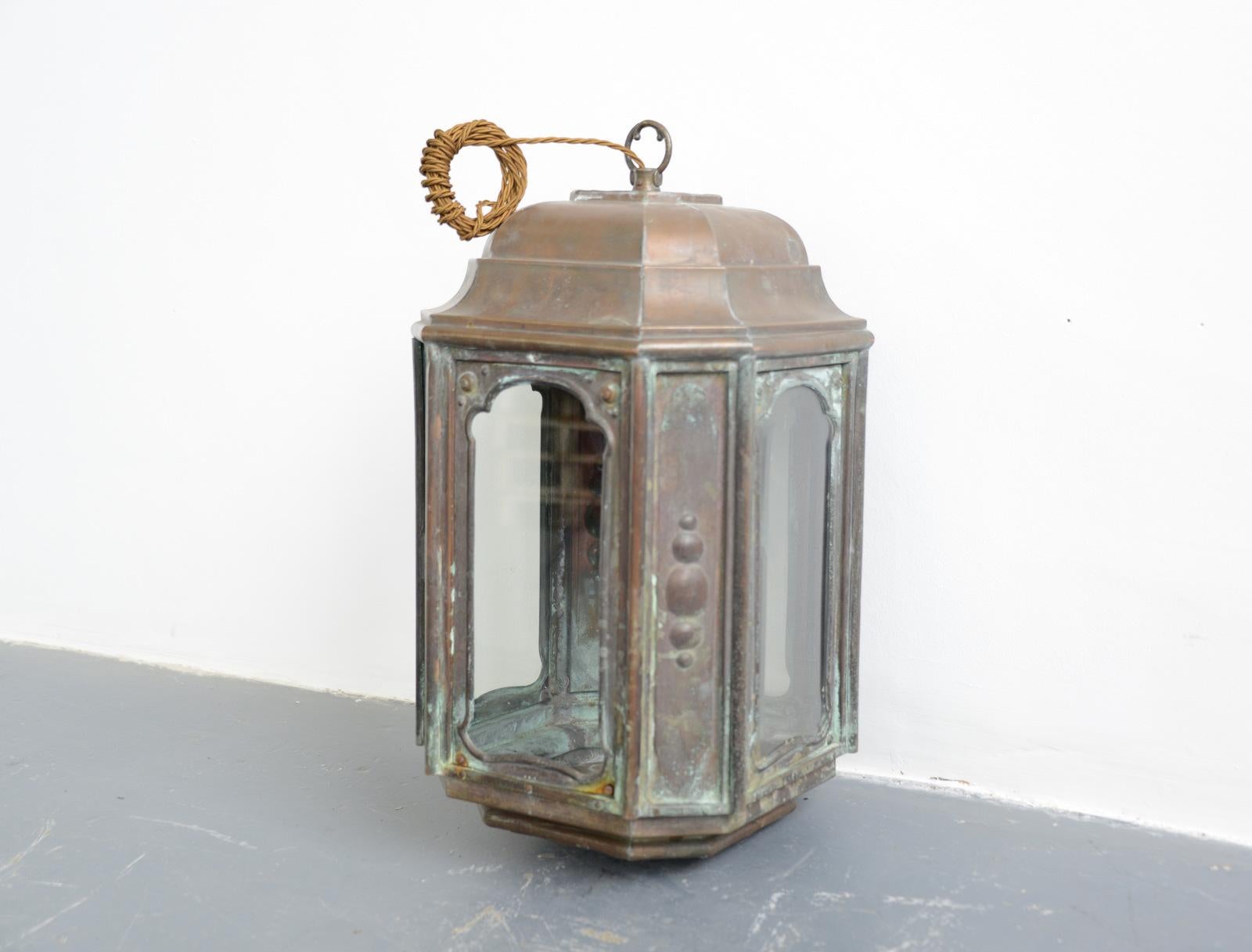 French Art Nouveau copper lantern, circa 1900

- Ornate copper casing
- 4 windows, 2 with bevelled glass, 2 with flat glass
- Takes E27 fitting bulbs
- French, 1900
- Measures: 58cm tall x 30cm wide x 30cm deep

Condition report

Fully re