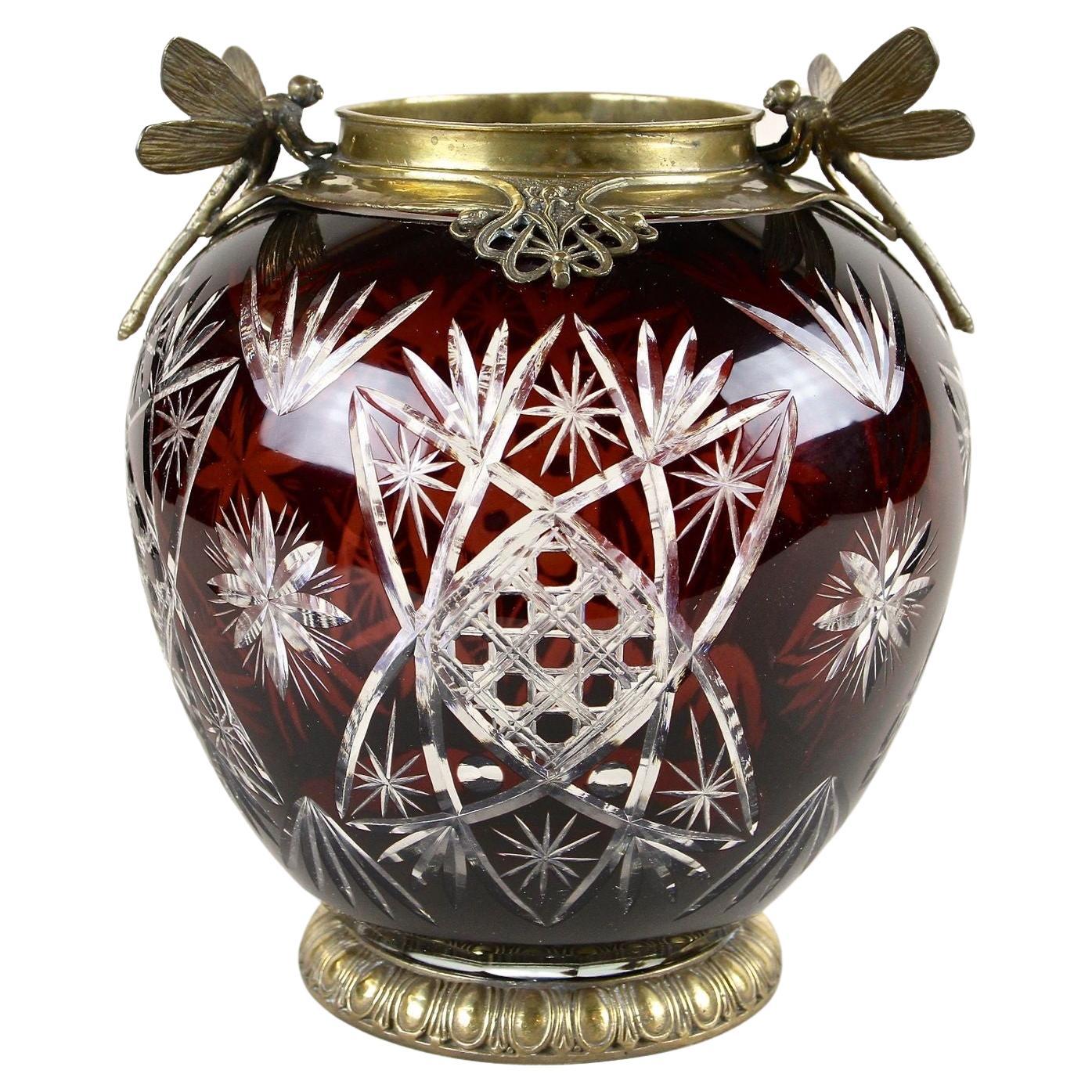 Exceptional, rare pair of 20th Century Cut Glass Vases with bronze mountings from the early Art Nouveau period in France around 1900. This outstanding pieces of French glass art impress with gorgeous, spherical shaped dark red bodies with amazing