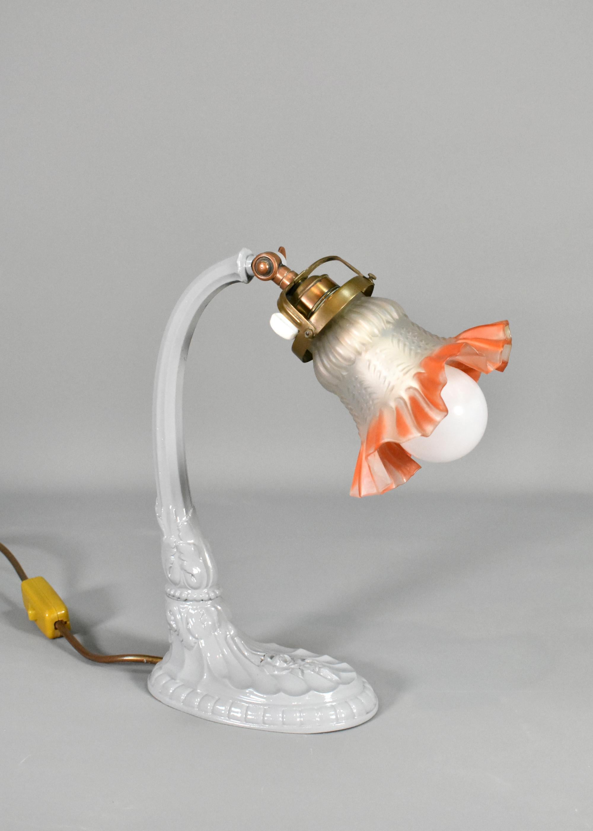 French Art Nouveau Desk Lamp

A beautiful and elegant swan-shaped desk lamp, featuring flowers and leaves, which are classic motifs from the Art Nouveau period.

The gently curved neck / support holds a copper and brass lamp holder and a cage for