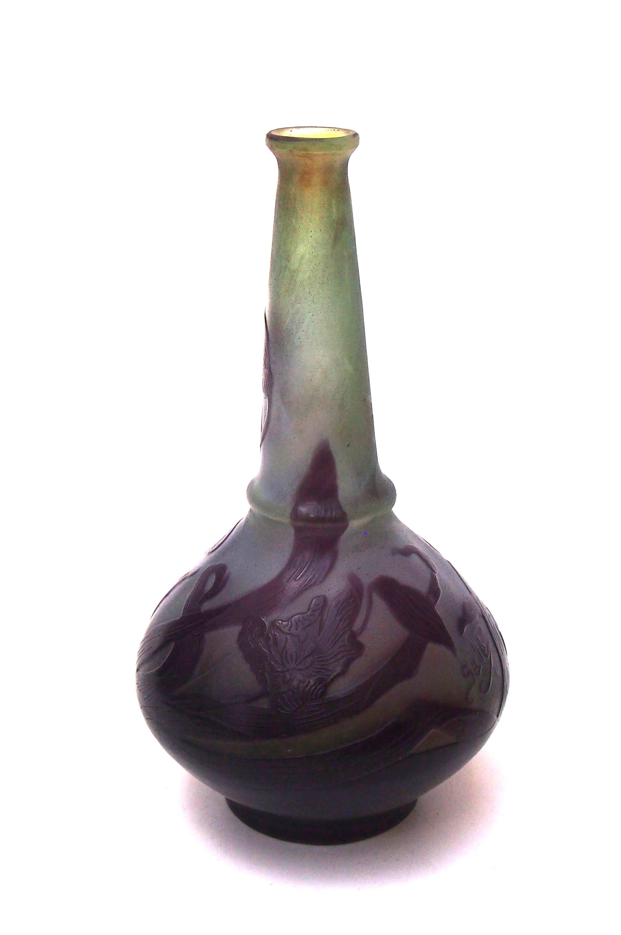 Particularly pretty small wide bellied Emile Galle Cameo glass vase with tall neck slightly flared to the top and to the base of the neck a rare and unusual shape in this size - Purple over blue, over green, depicting unidentified flowers with long