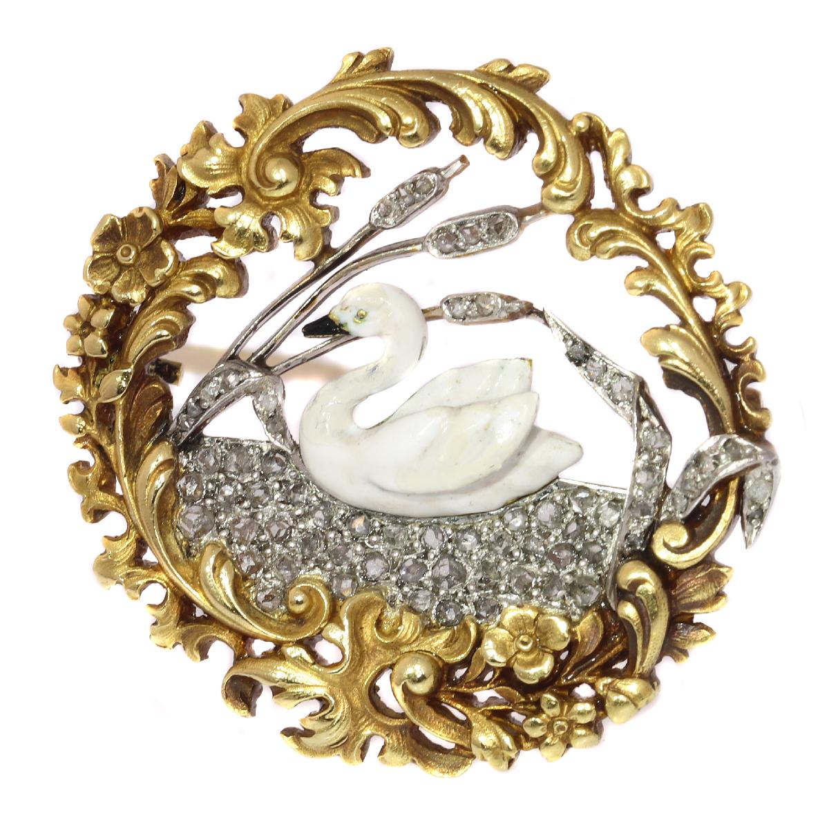 Envision this French Victorian 18K yellow gold brooch with a white enamelled balletic swan resting between the reedmace of a shimmering lake full of silver-encrusted rose cut diamonds as the miniature scenery through the hedge window of your garden.