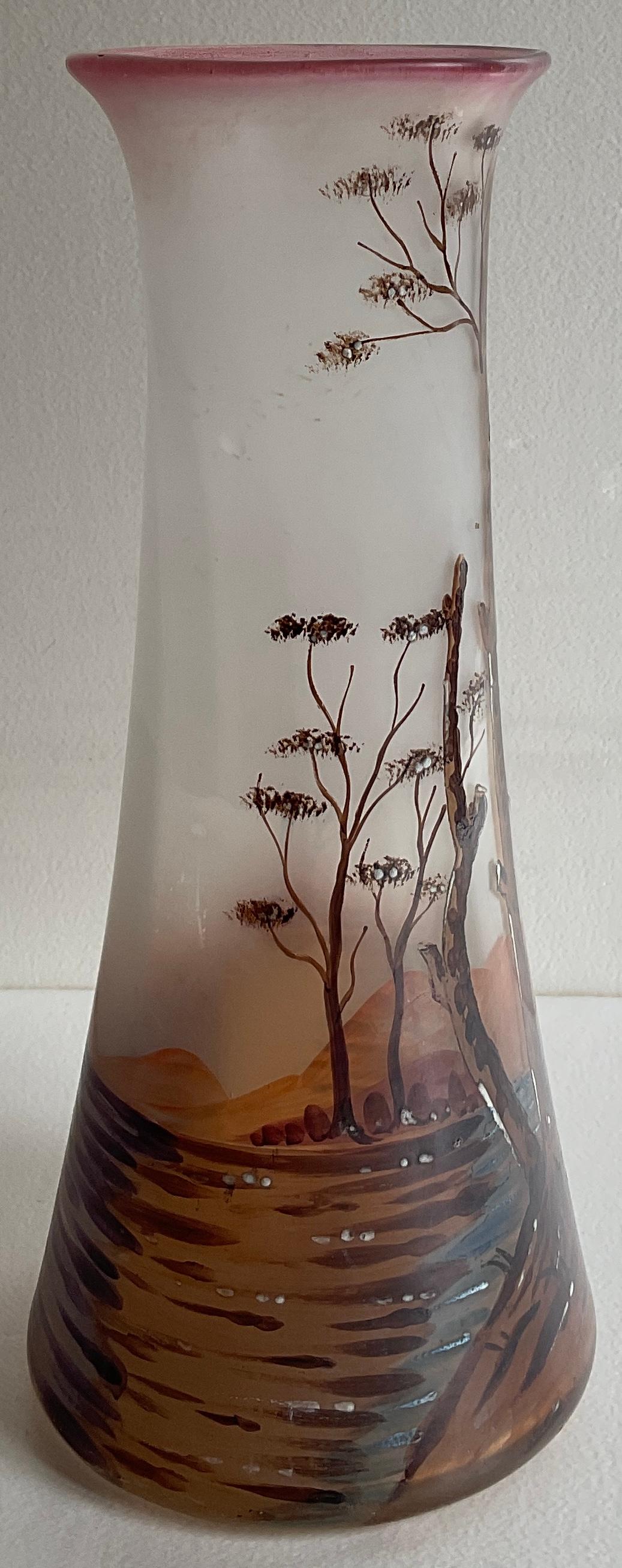 A beautiful French enameled glass vase from the Art Nouveau period, circa 1930. Intricately detailed work is by François-Théodore Legras.

The tube of this vase is enlarged and has a dark pink background. It is decorated with trees, a bird, plants