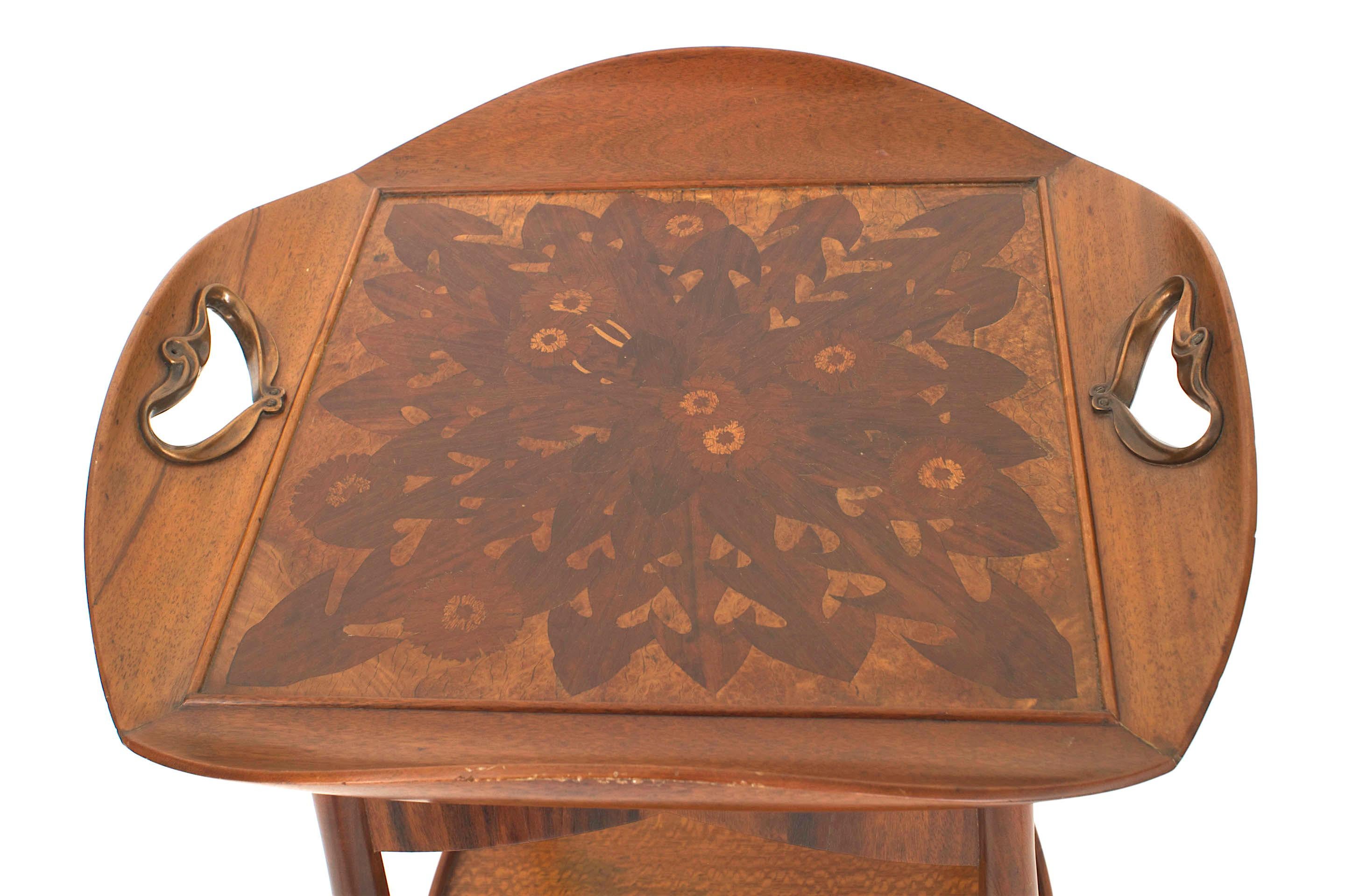 French Art Nouveau walnut square end table having a floral inlaid tray top with open copper handles and curved raised sides with a burl maple bottom shelf. (Attributed to MAJORELLE)
