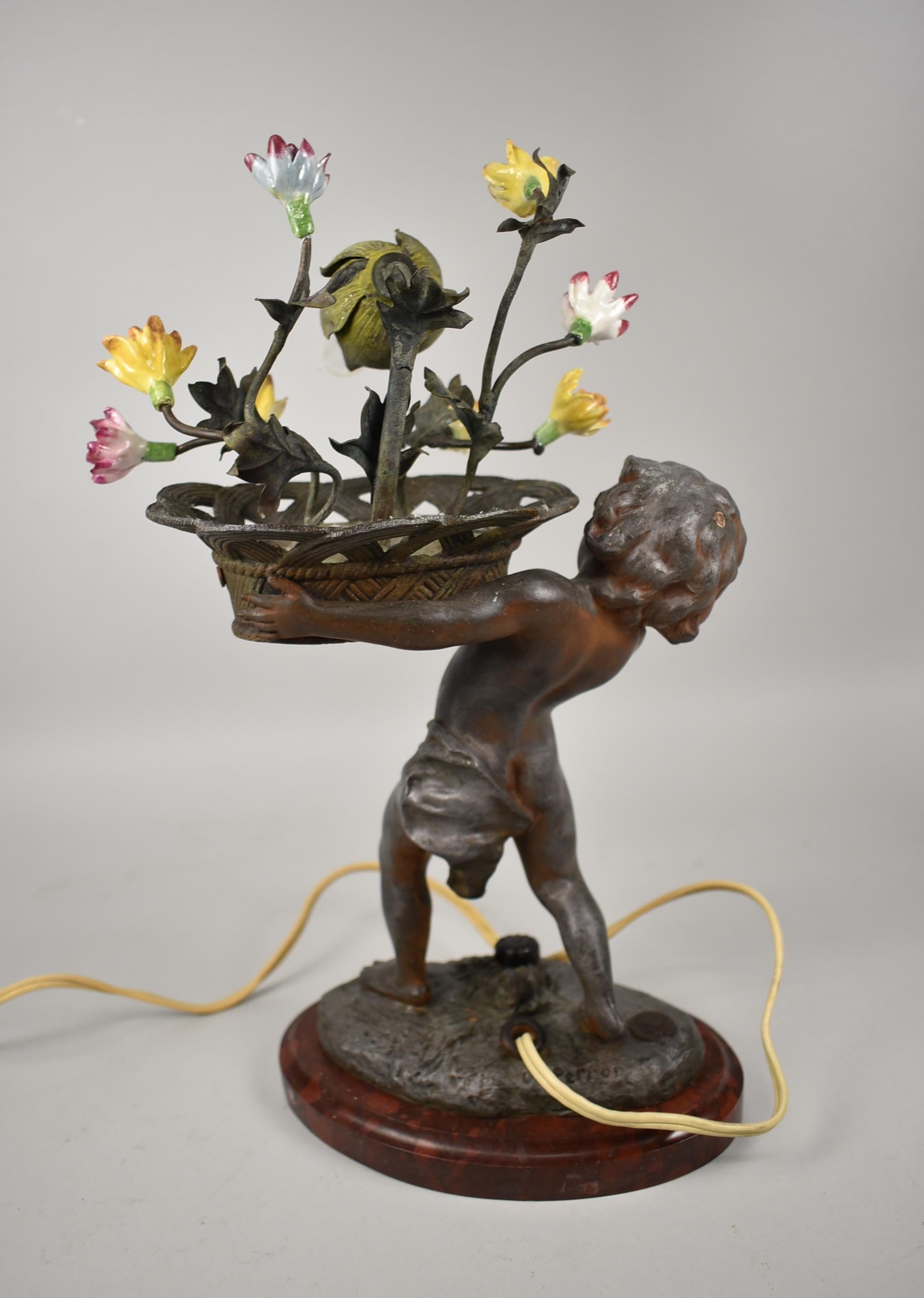 Figural Art Nouveau lamp with child holding a basket of colorful flowers. Made in Paris France by Charles Perror 1862-1934. Working order. Dimensions: 13