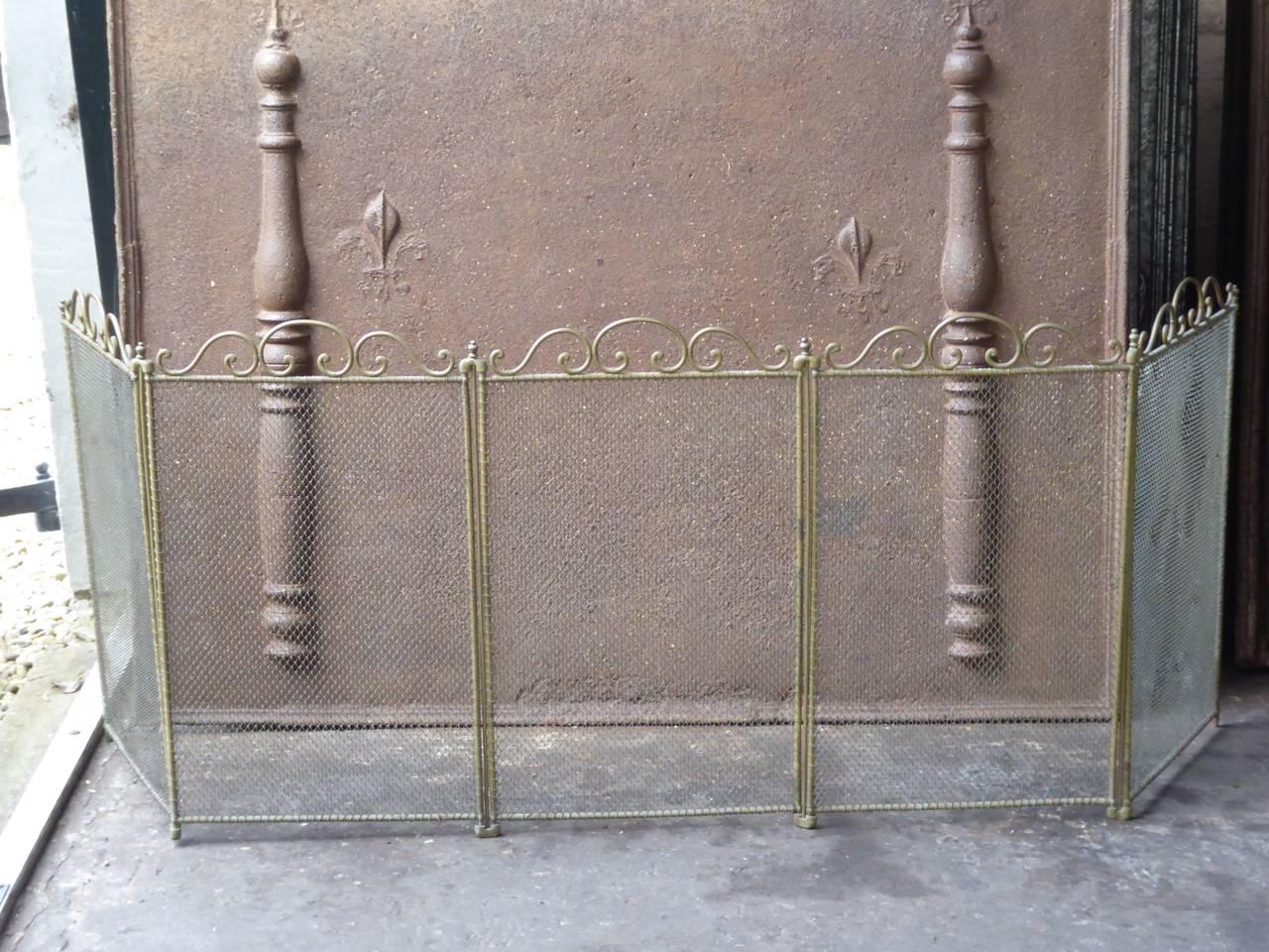 French Art Nouveau fireplace screen made of brass and iron mesh.

We have a unique and specialized collection of antique and used fireplace accessories consisting of more than 1000 listings at 1stdibs. Amongst others we always have 300+ firebacks,