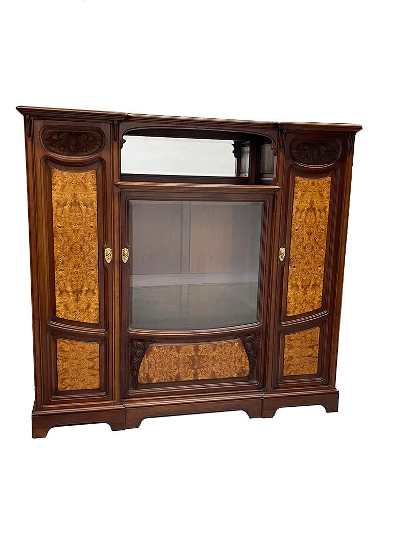 French Art Nouveau furniture by Louis Chambry, ca 1900

An Art Nouveau set consists of a bookcase, mirror, desk with office chair and two separate chairs by Louis Chambry, France, circa 1900
The desk and bookcase have a metal plate with the text