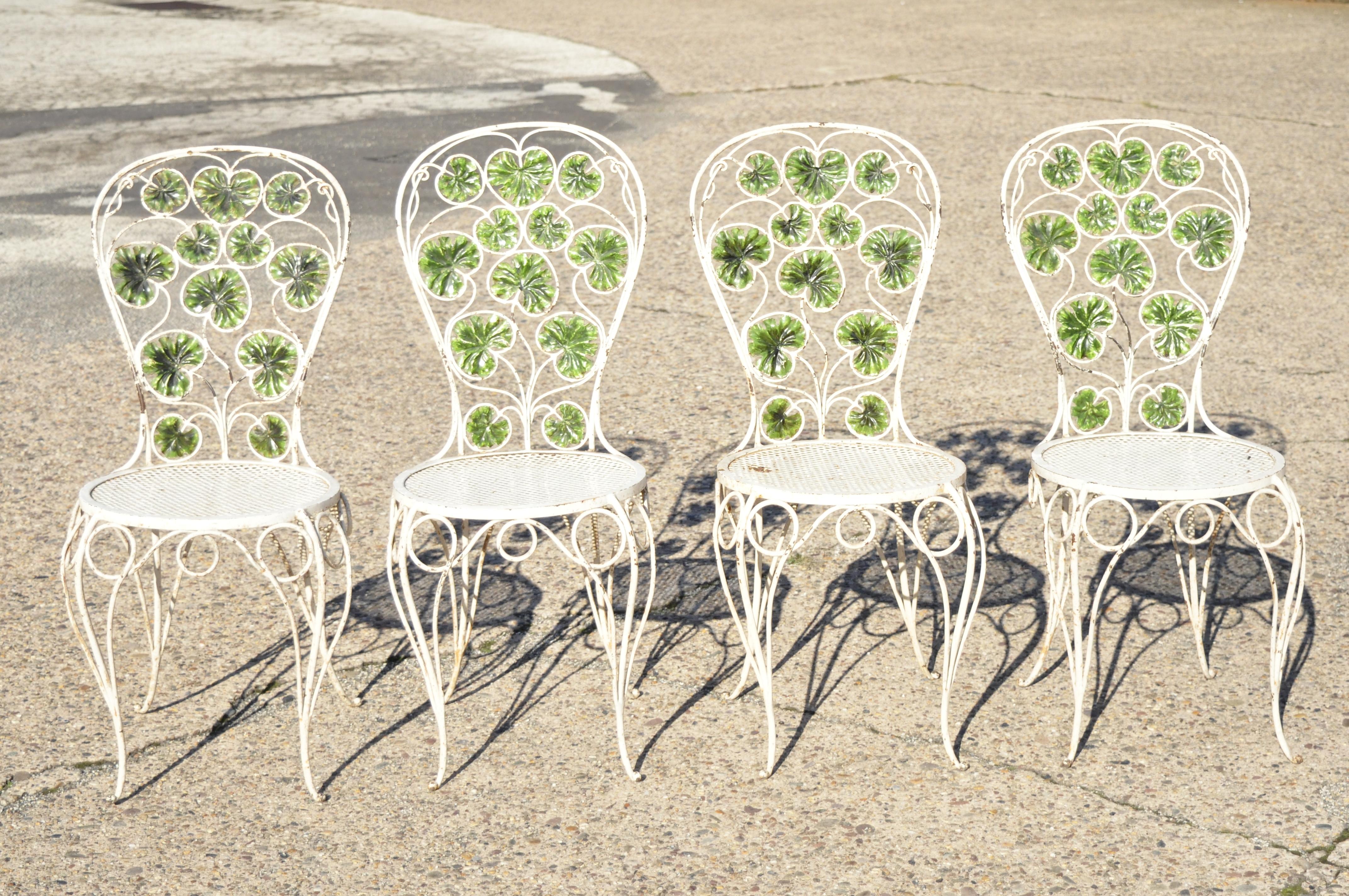 Antique French Art Nouveau Green Flower Maple Leaf Garden Patio Dining Set - 5 Piece Set. Set includes (4) side chairs, (1) dining table, green painted maple leaf frames, shapely legs, ornate flower stretcher base to table, perforated mesh seats,