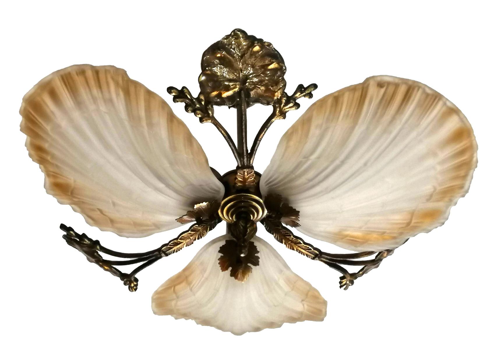 Art Nouveau chandelier or flush mount with petal or shell shaped frosted glass and leaf design brass.
