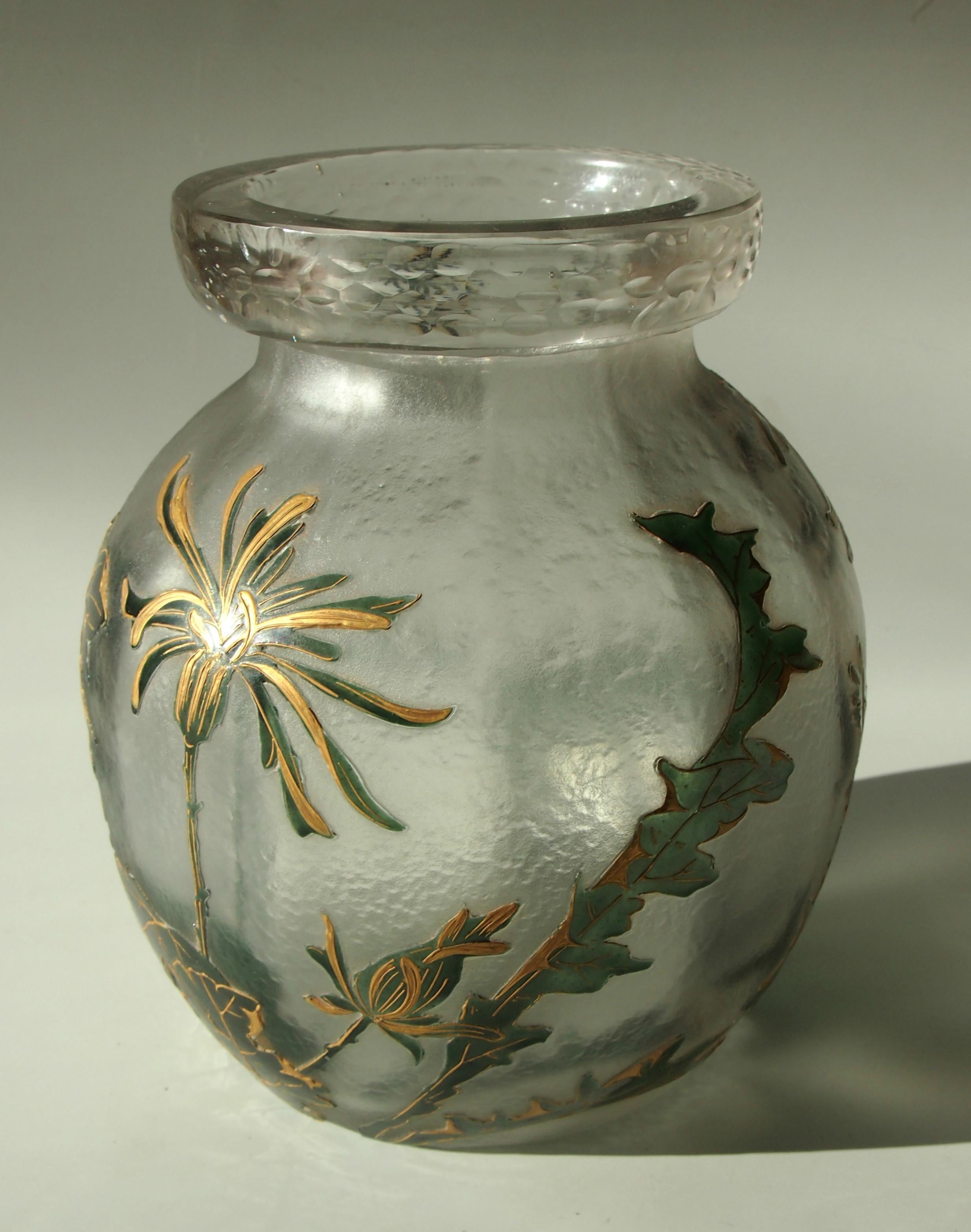 Stunning deeply acid cut back gilded and enamel early Art Nouveau Legras vase, decorated with stylised blooms and foliage in dark green and gold. It also has unusual Martele style work to the top collar (see image 7).

Legras at the time were the