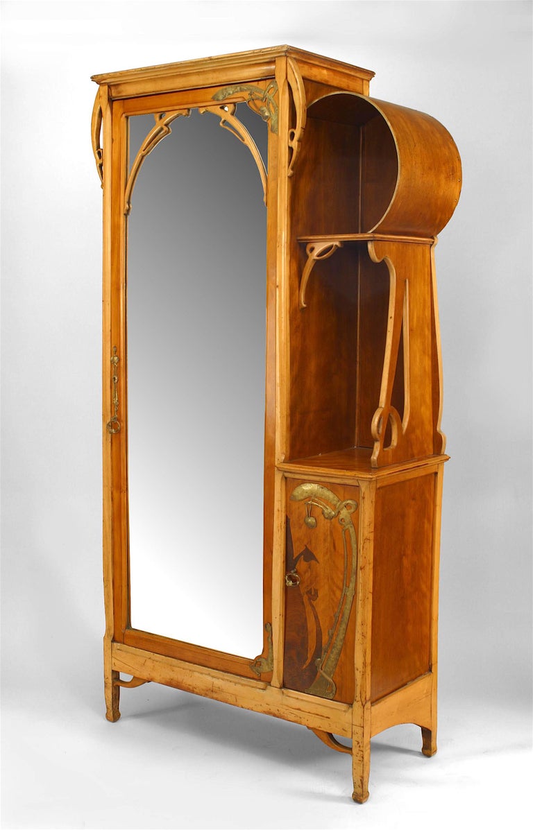 French Art Nouveau maple and inlaid armoire cabinet with brass trim and mirrored door and small side door with shelf (Attributed to Leon Benouville)
