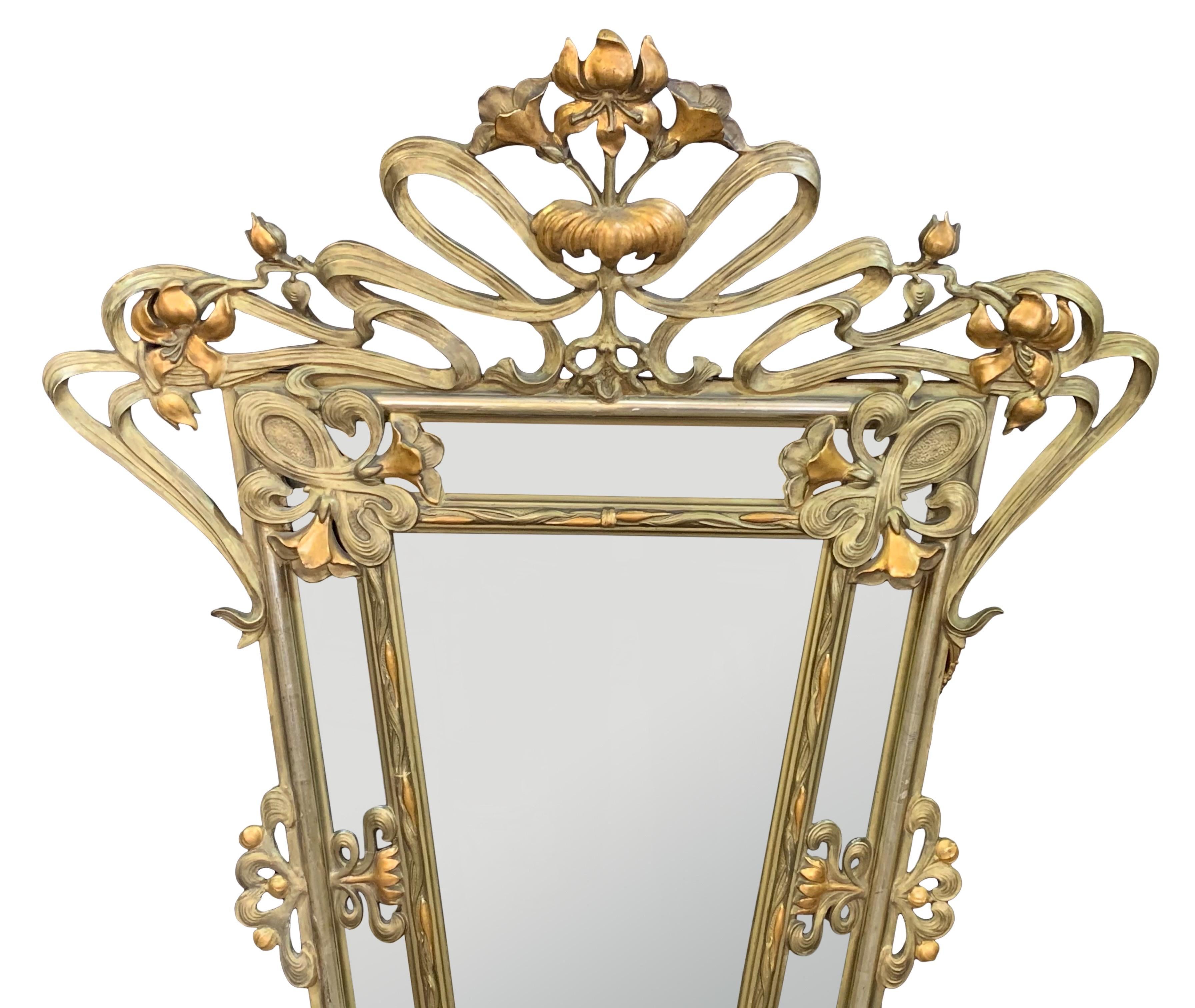 A Stunning French Art Nouveau hand carved giltwood mirror. Beautifully carved with lily flowers and scroll design.
Circa: 1900.

Art Nouveau is an ornamental style of art that flourished between about 1890 and 1910 throughout Europe and the United