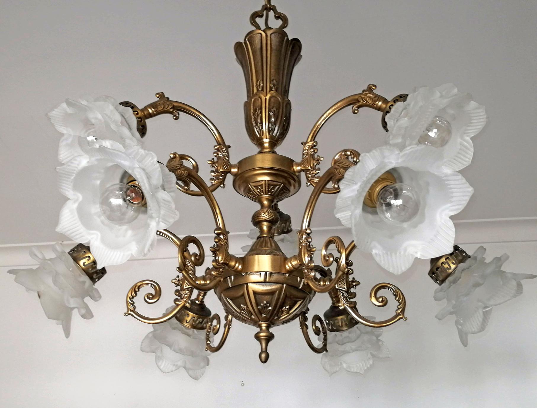 Ornate French Art Nouveau and Art Deco 2 tiers, frosted satin art glass flower petal lamp shades chandelier

Measures:
Diameter 29.5 in/ 75 cm
Height 33.4 in / 85 cm
Weight 15 Kg / 32 lb
9-light bulbs E14 good working condition
Assembly required.