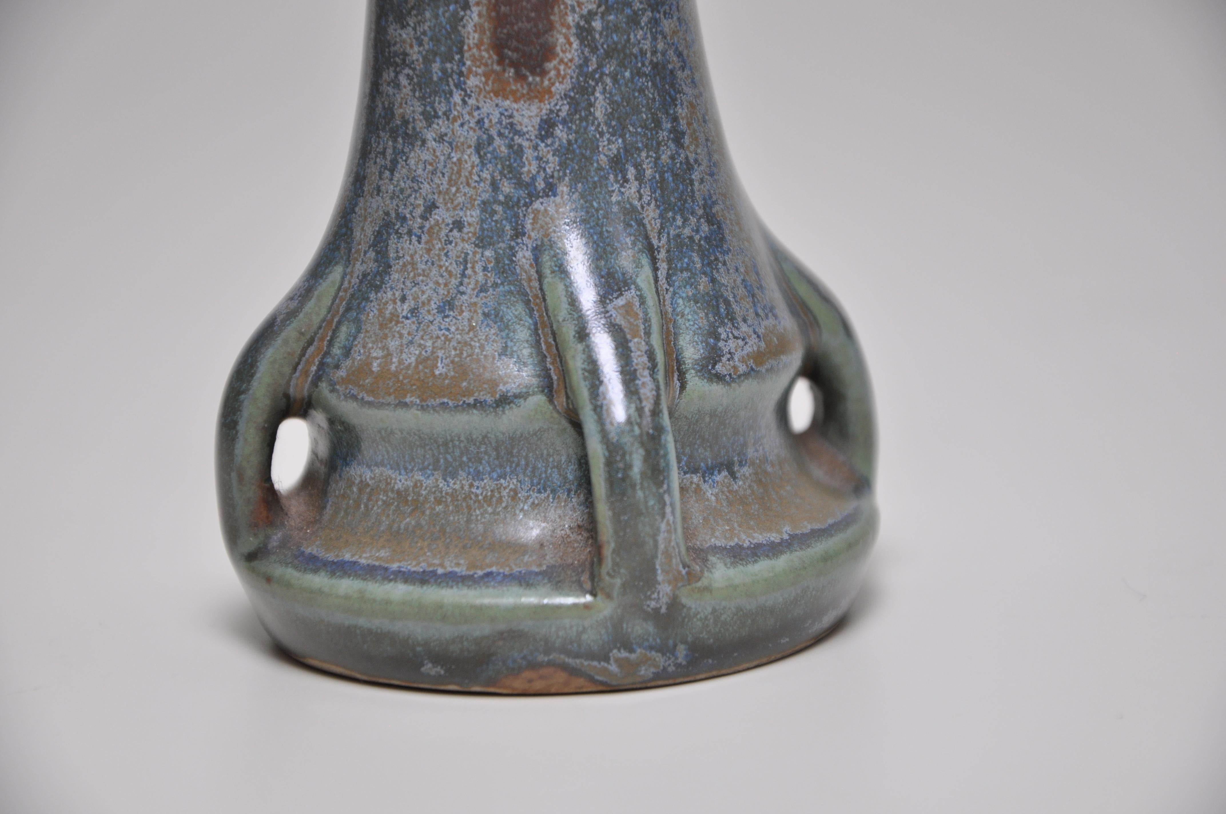 French Art Nouveau pottery blue green vase Denbac ceramic potmic pot     

An attractive small French art pottery vase of flaring-neck shape supported by four miniature buttresses, covered with a flowing glaze of soft texture and subtle color,