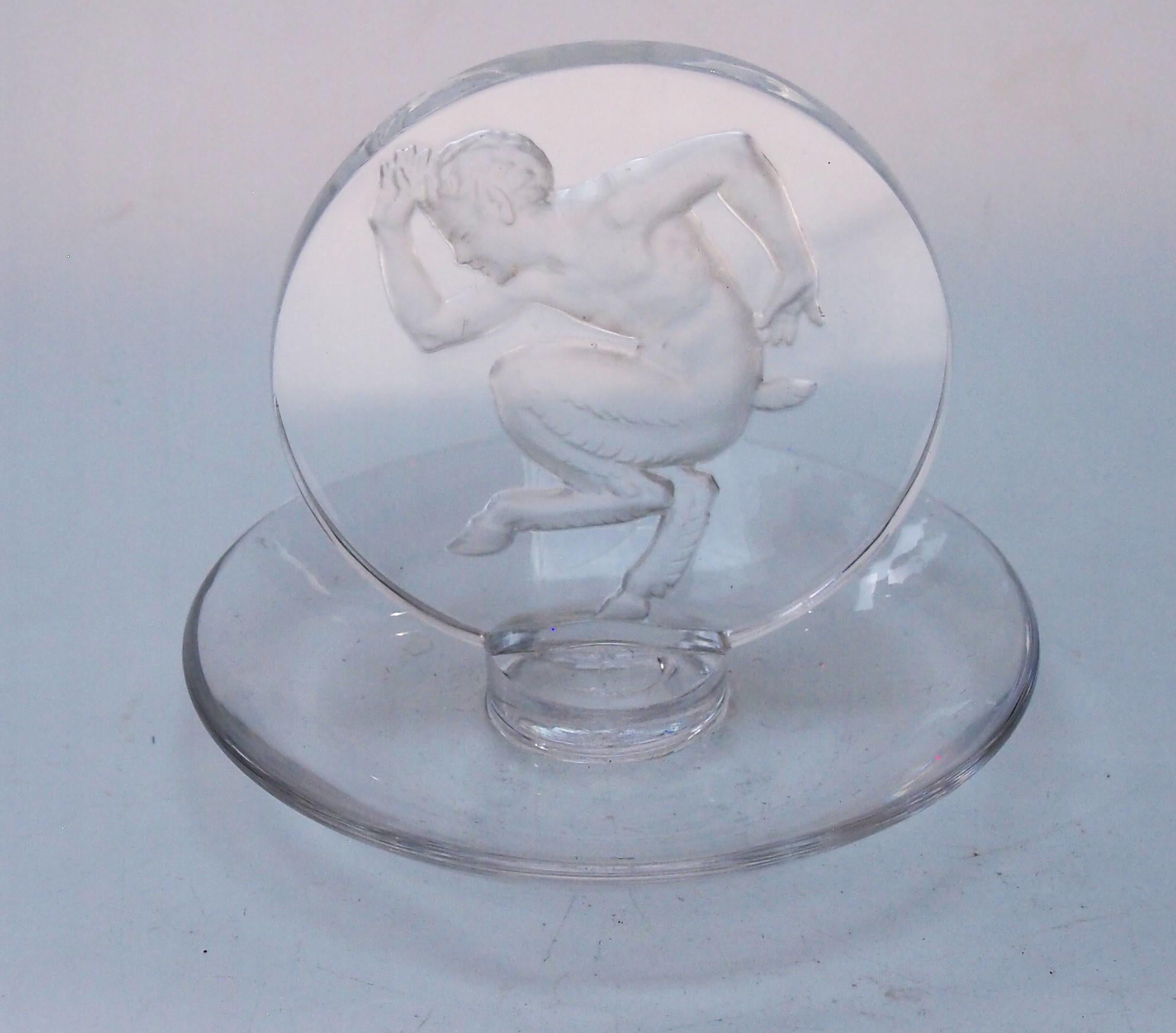 An very rare signed (R Lalique) Rene Lalique 'Faune' pintray -depicting a dancing or running goat legged child beast, dating from 1931 (Marcilhac ref: 316). Such pin trays were designed for ladies dressing tables - the perfect gift for a gentleman