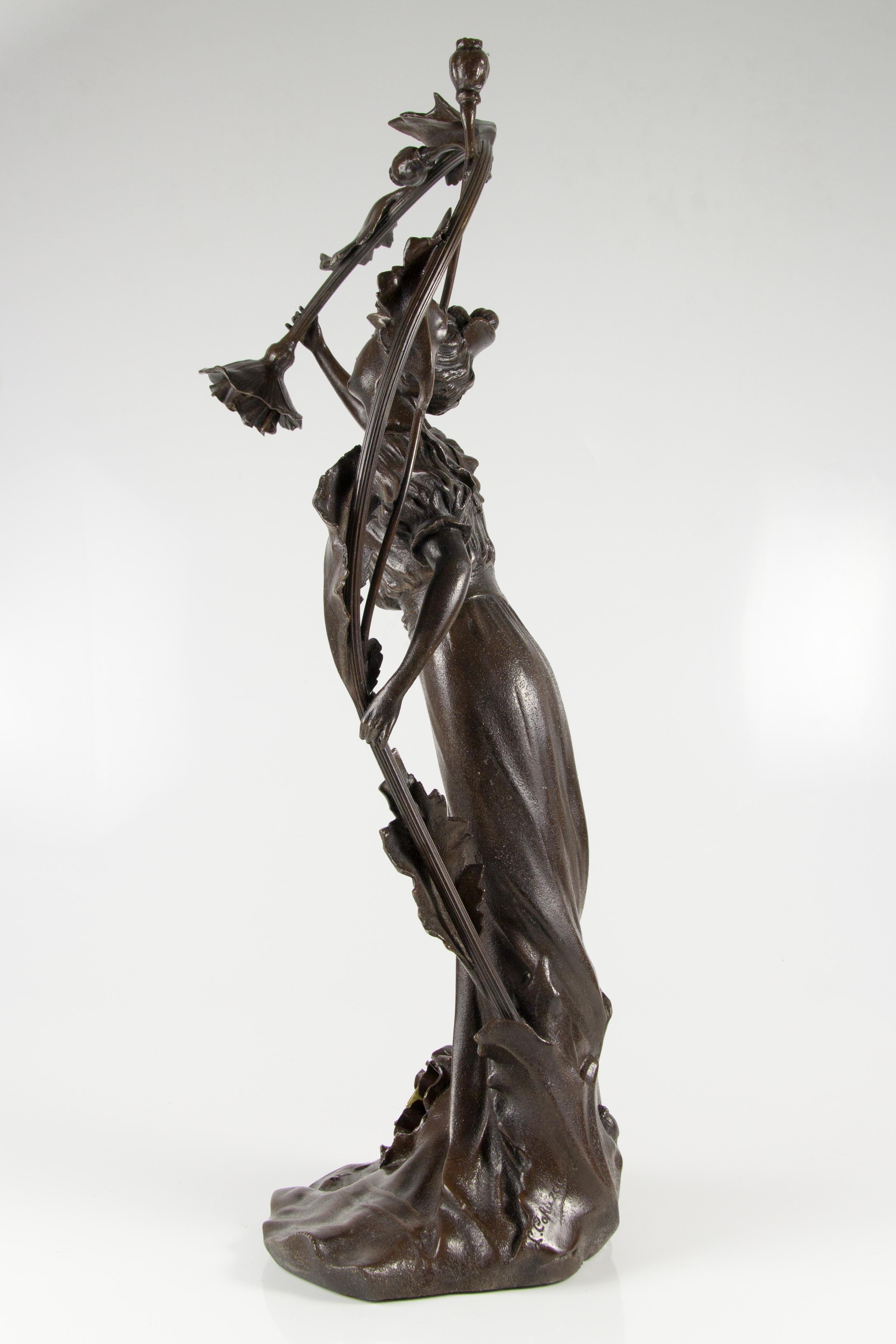 A stunning Art Nouveau style spelter figural lamp with a young lady figure holding poppy flower. Two sockets for B 15 light bulbs.
Measures:
Height 67 cm / 26.37 in; width 30 cm / 11.81 in; depth 23 cm / 9.05 in.
Base 21 cm x 21 cm / 8.26 in x