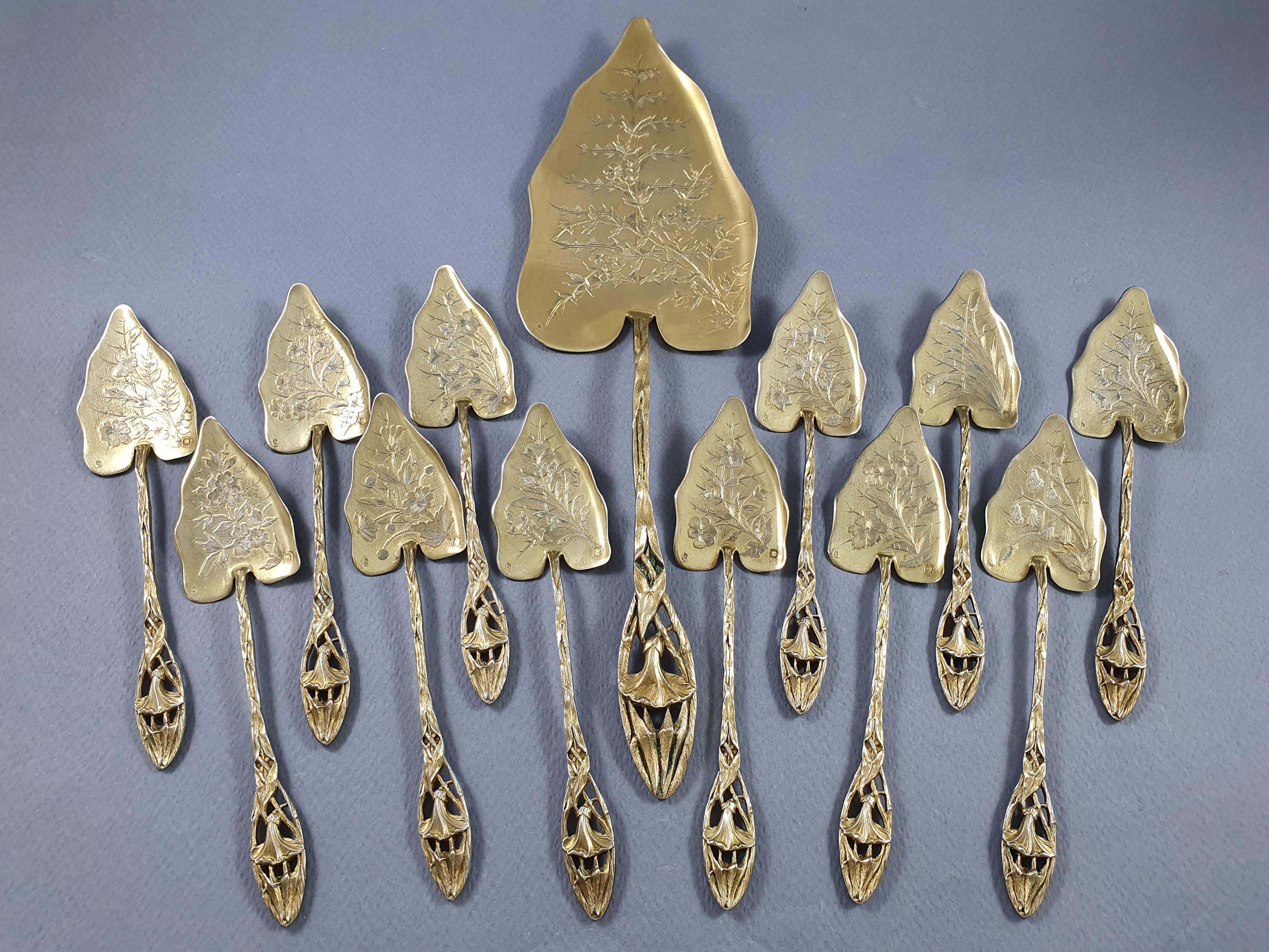 Exceptional sterling silver gilt ice cream service (gold on sterling silver) from the Art Nouveau period 

Composed of a serving piece and 12 spoons 

Each spoon is finely chiseled with a different flower

Serving piece: 26.7 cm - 10.5