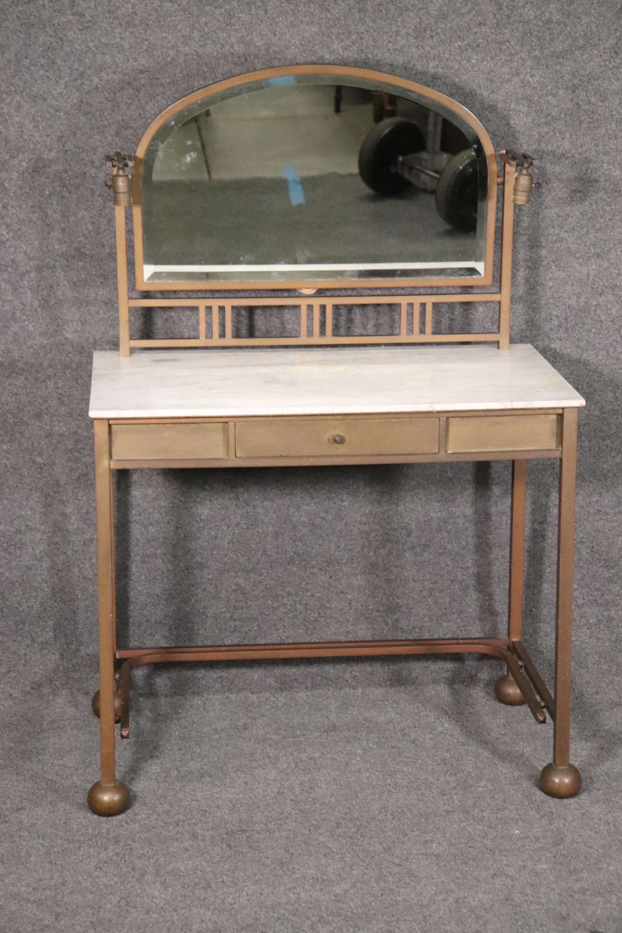 Dimensions: H: 50in W: 34 3/4in in D: 20 1/4in
This is an exceptional piece made by Pardon. They were in business from the late 19th century to the early 20th century. If you look closely you can see the entire vanity is made from bronze and