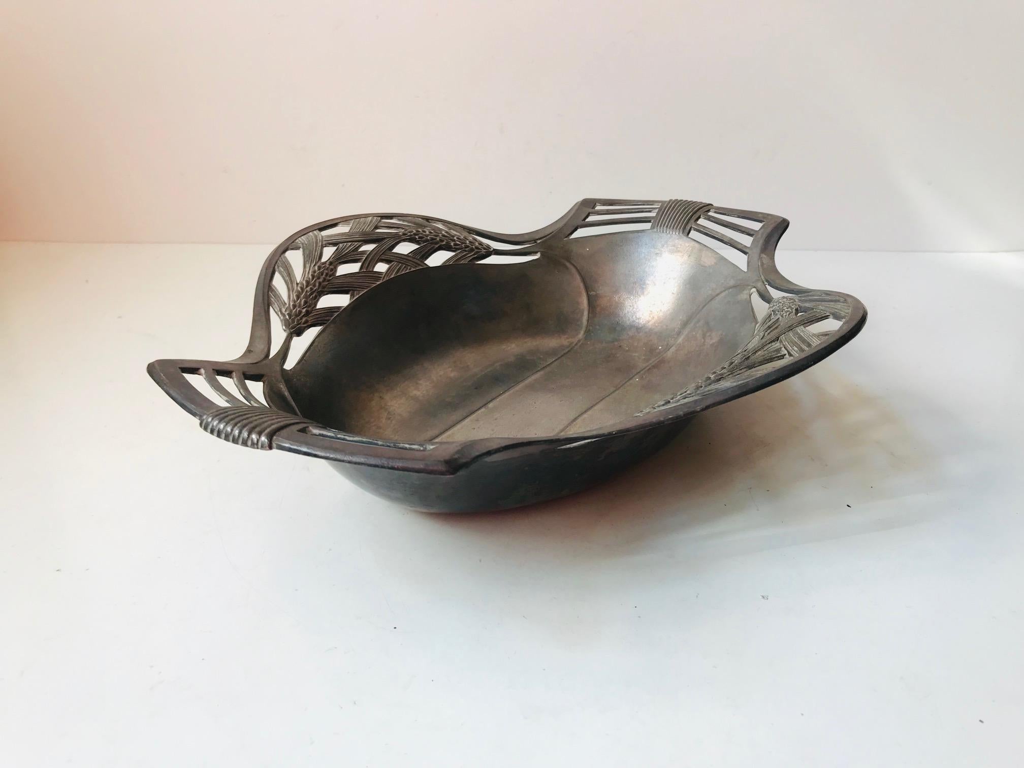 - A decorative fruit/bread basket or tray
- Made of partially perforated pewter
- With intricate details and fine period features
- It is numbered and signed by an anonymous French maker beneath the base.
